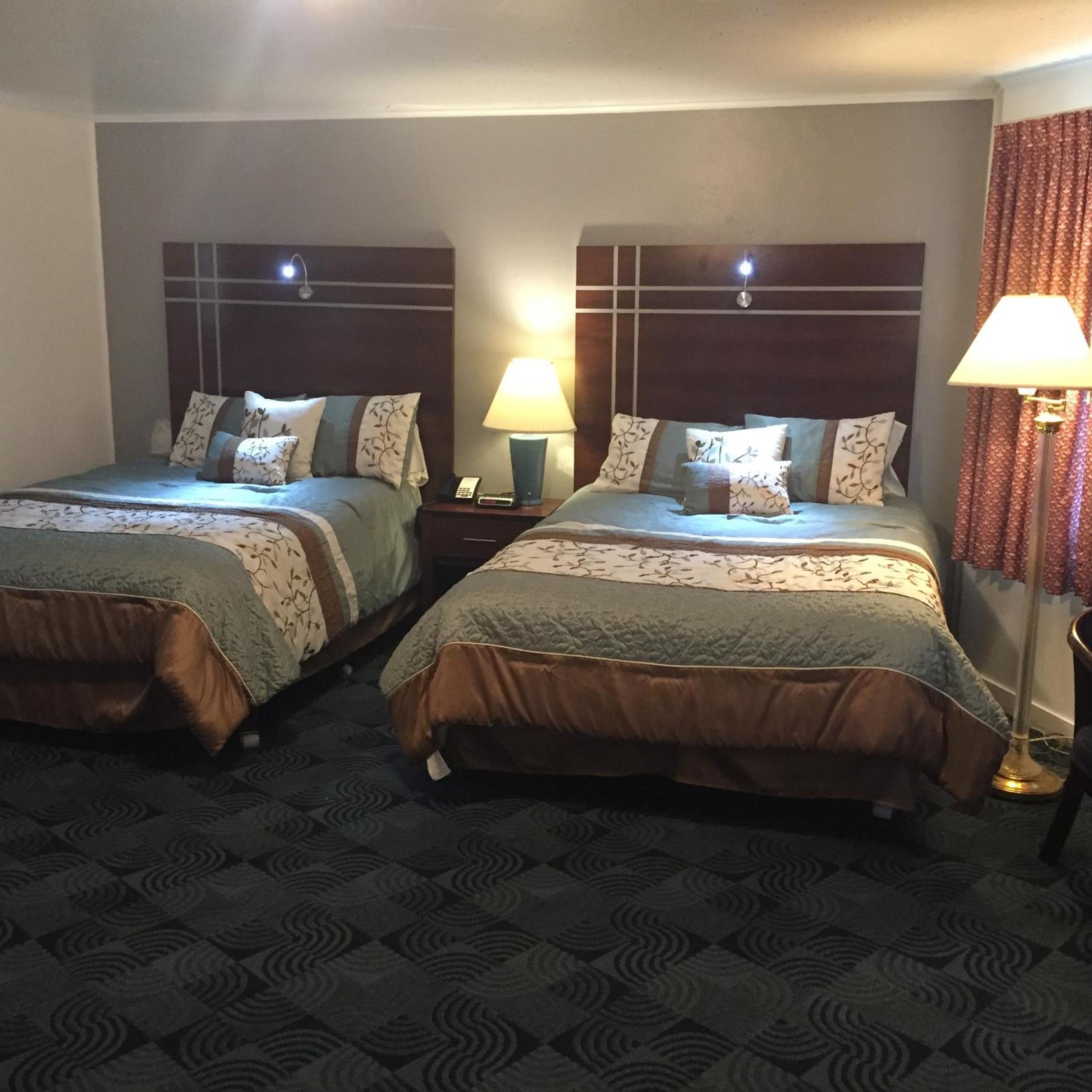 Queen Room with Two Queen Beds and Sofa Bed - Photo 1