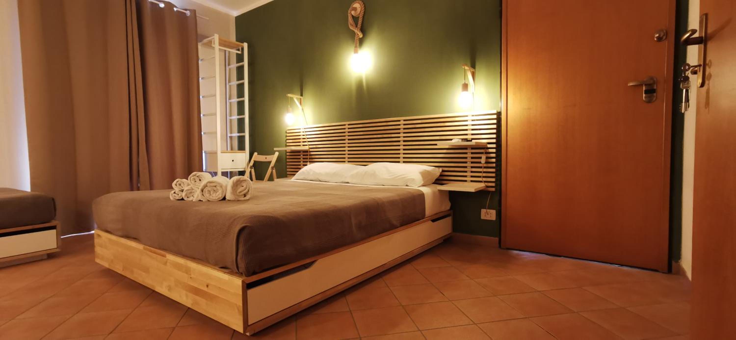 Quadruple Room with Balcony - Photo 1