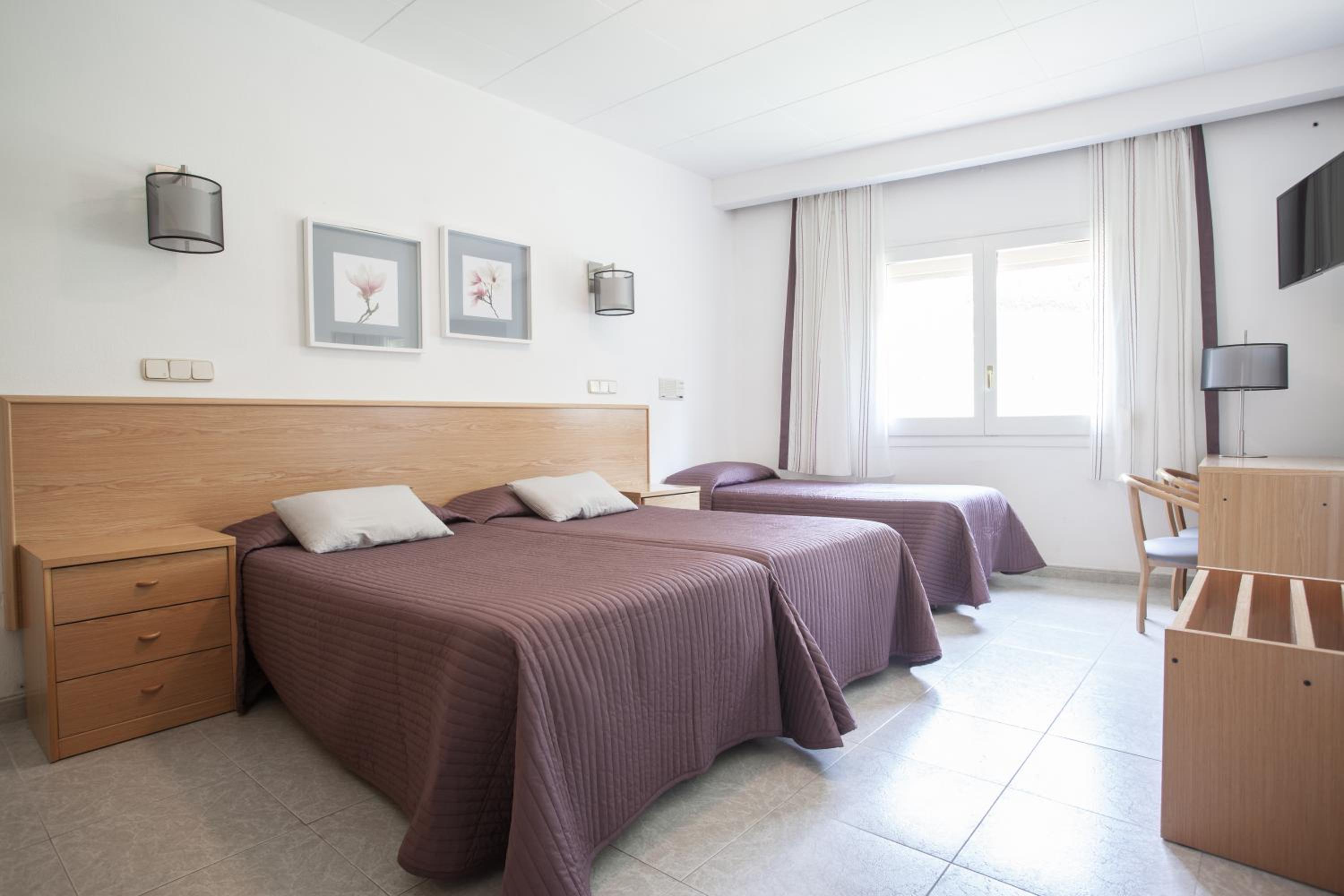 Habitación Cuádruple (2 Adultos + 2 Niños)