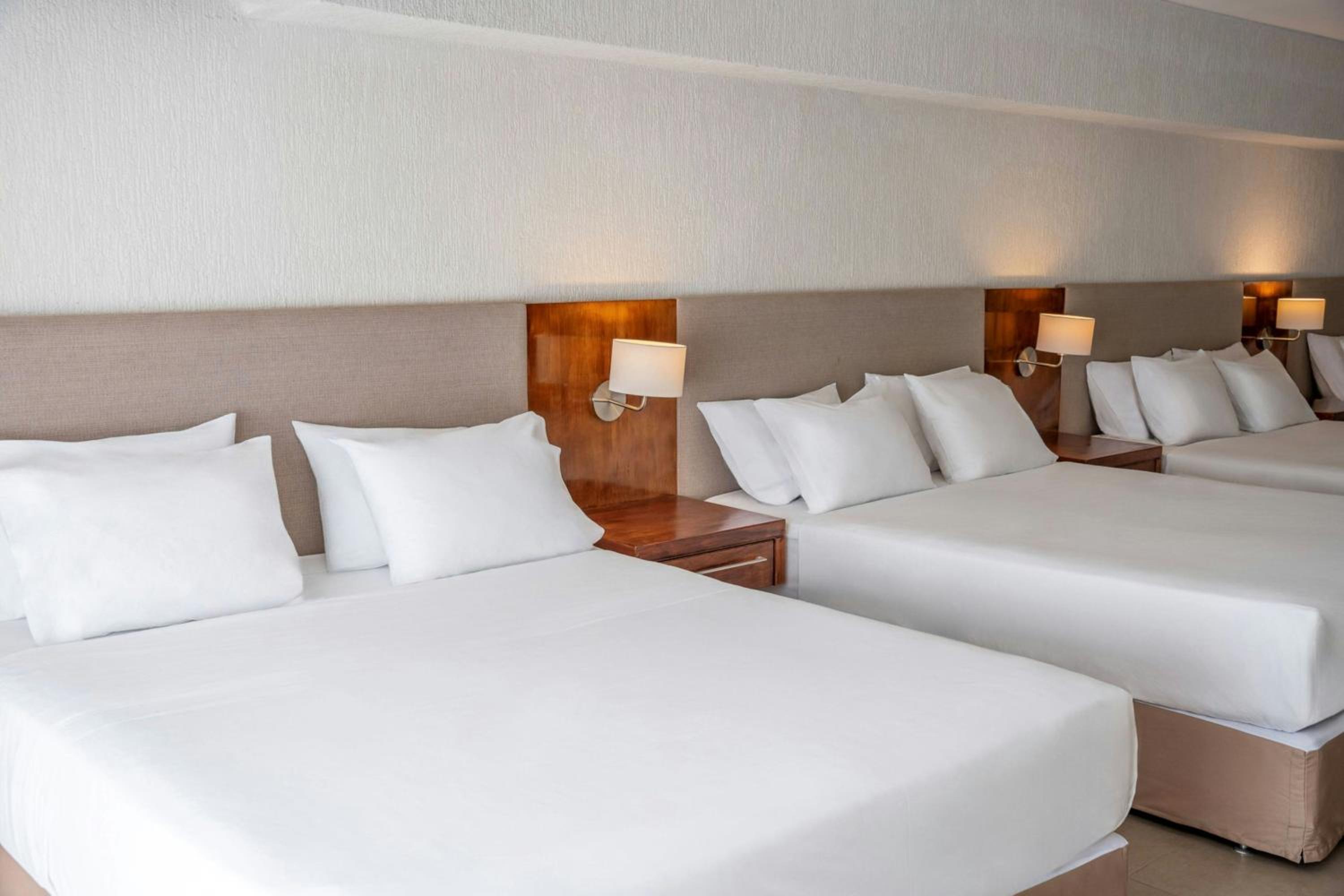 Premier Queen Room with Two Queen Beds - Photo 1