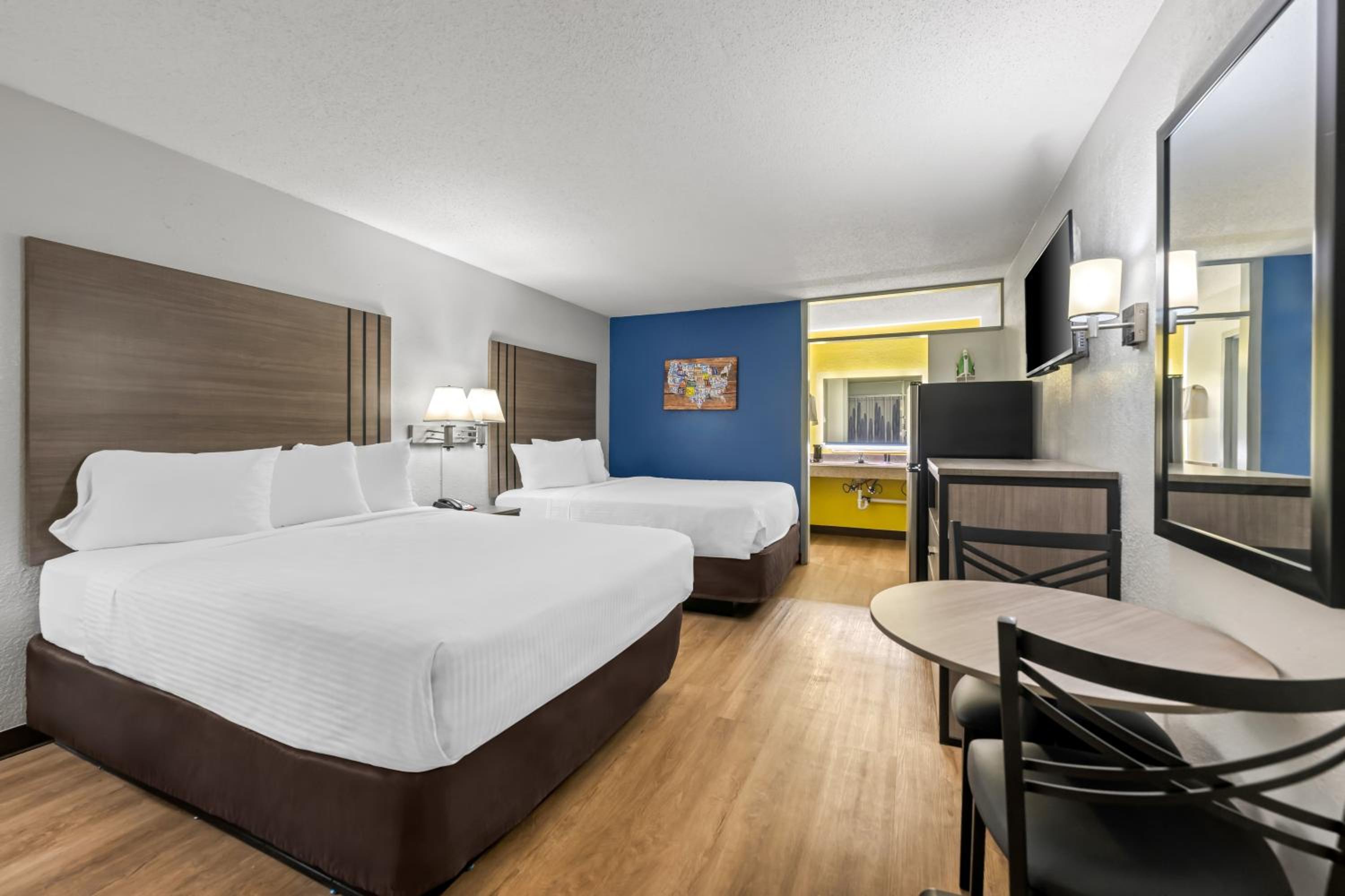 Efficiency Quadruple Room with Two Queen Beds - Non Smoking