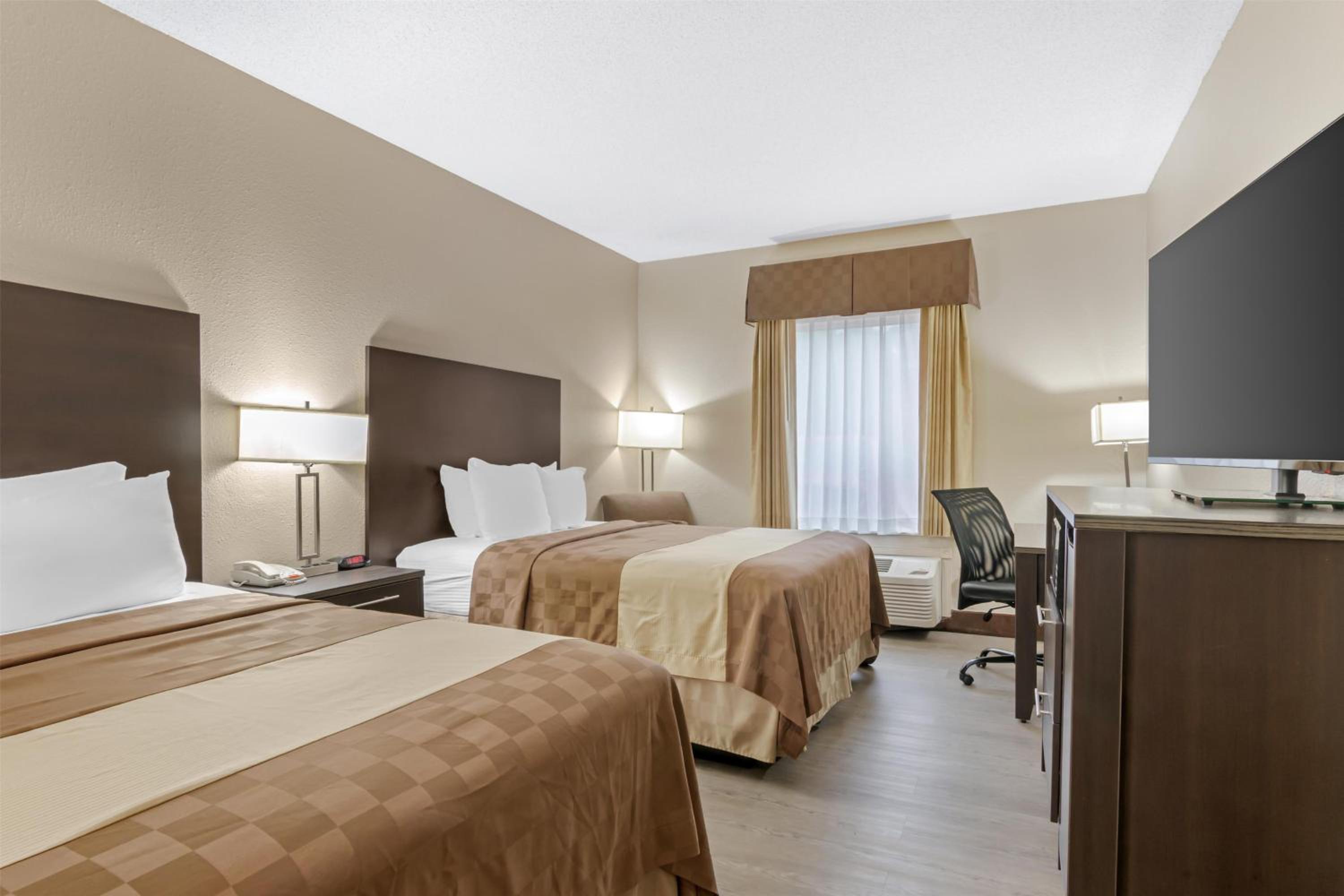 Queen Room with Two Queen Beds - Pet Friendly/Non-Smoking - Photo 1