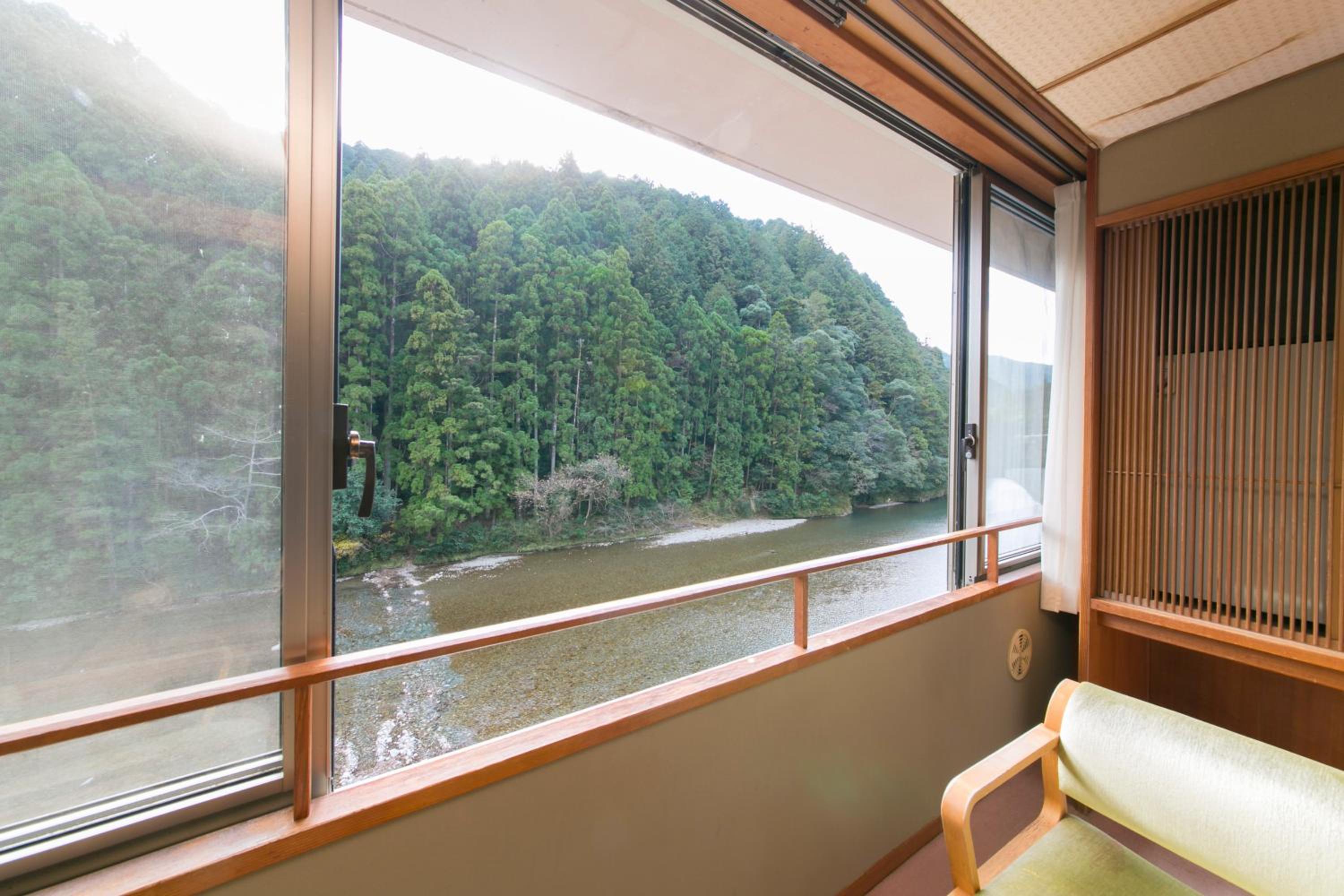 Japanese-Style Room With River and Forest View photo 2