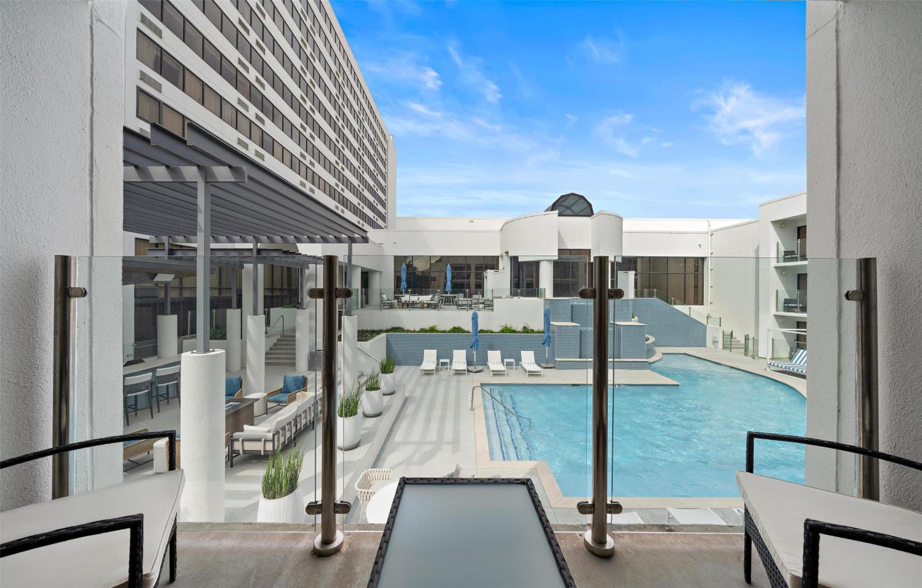 Queen Room with Two Queen Beds and Poolside View - Photo 1