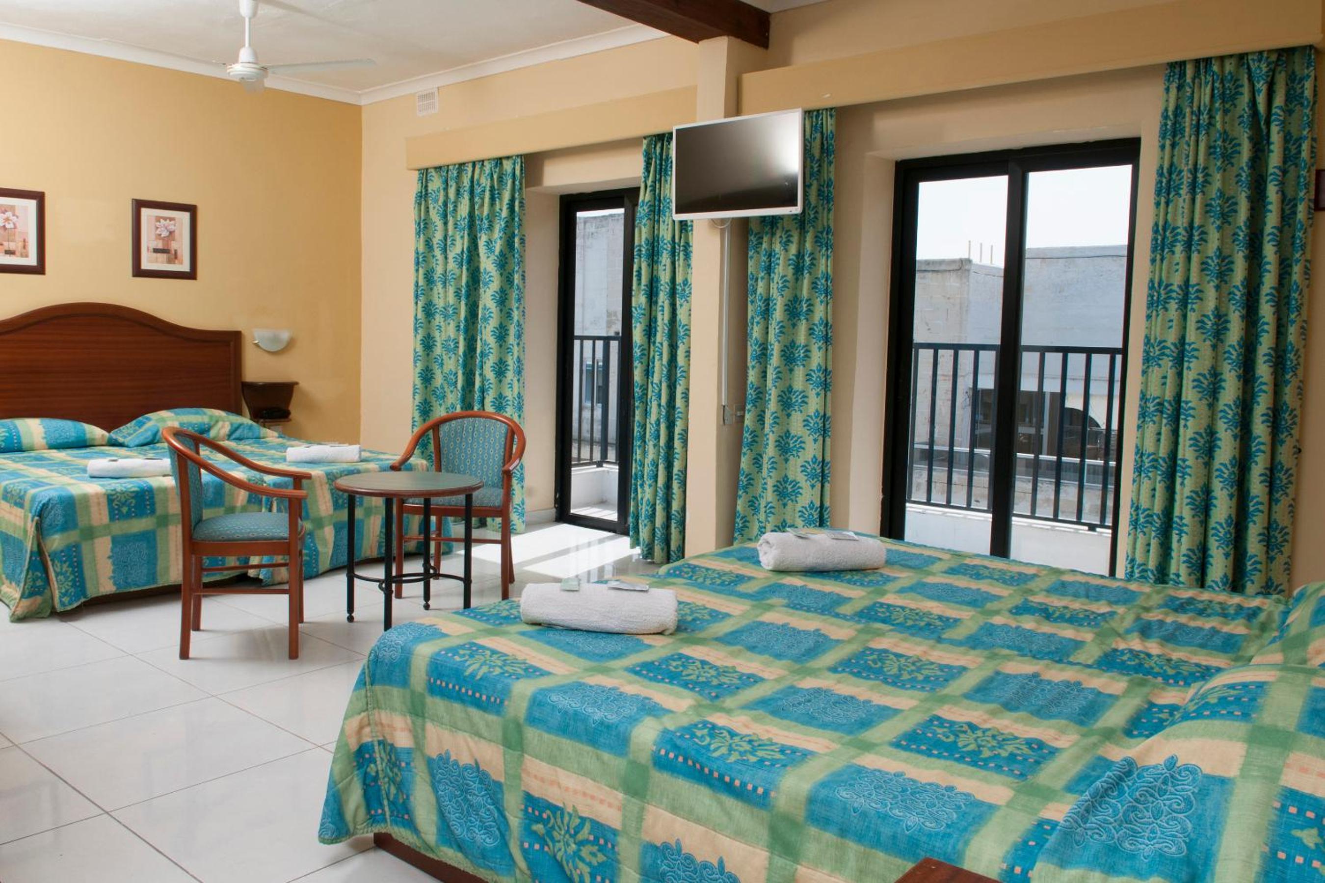 Quadruple Room With Balcony And Airport Shuttle Included