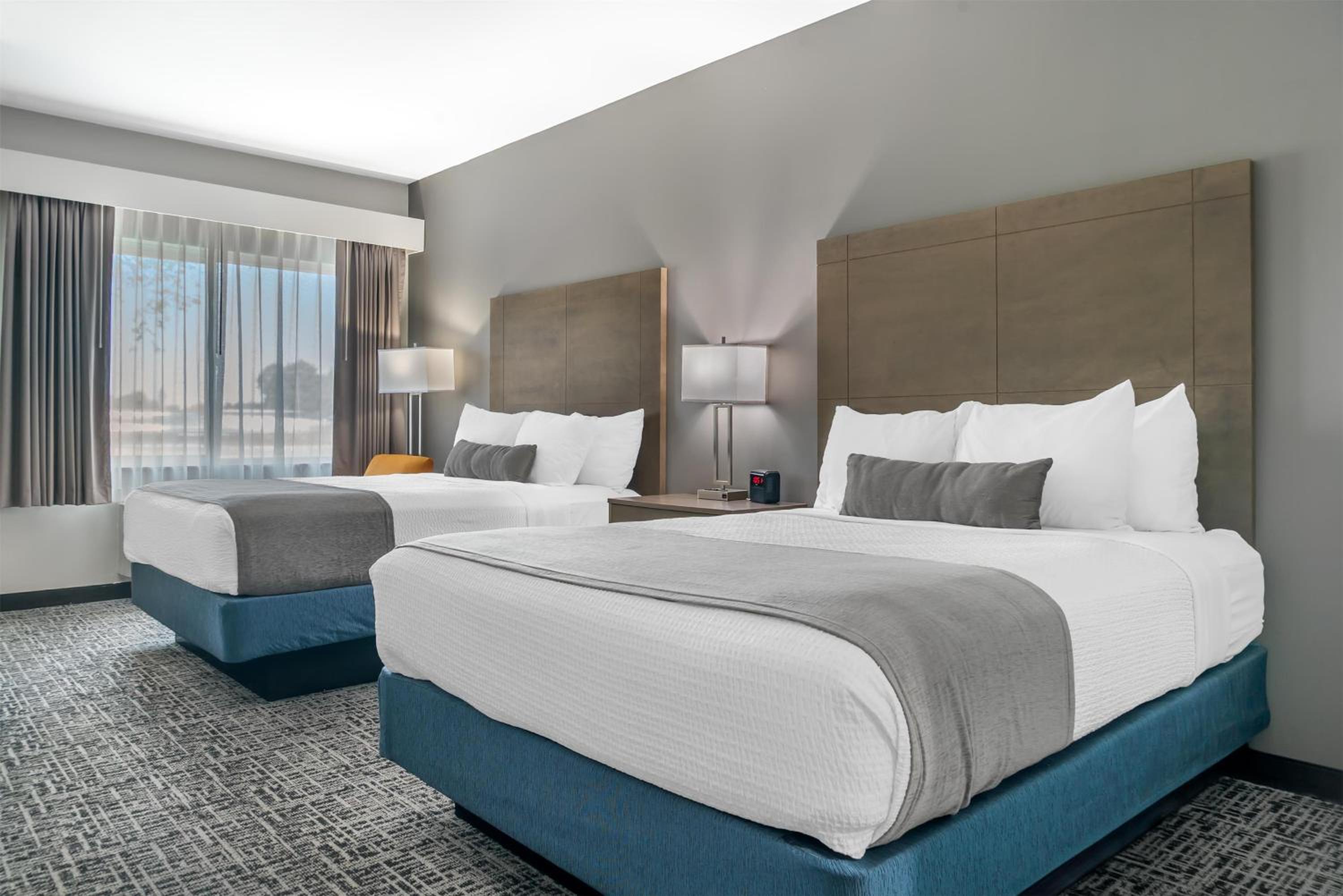 Queen Room with Two Queen Beds and Mobility Accessible Roll-In Shower - Photo 1