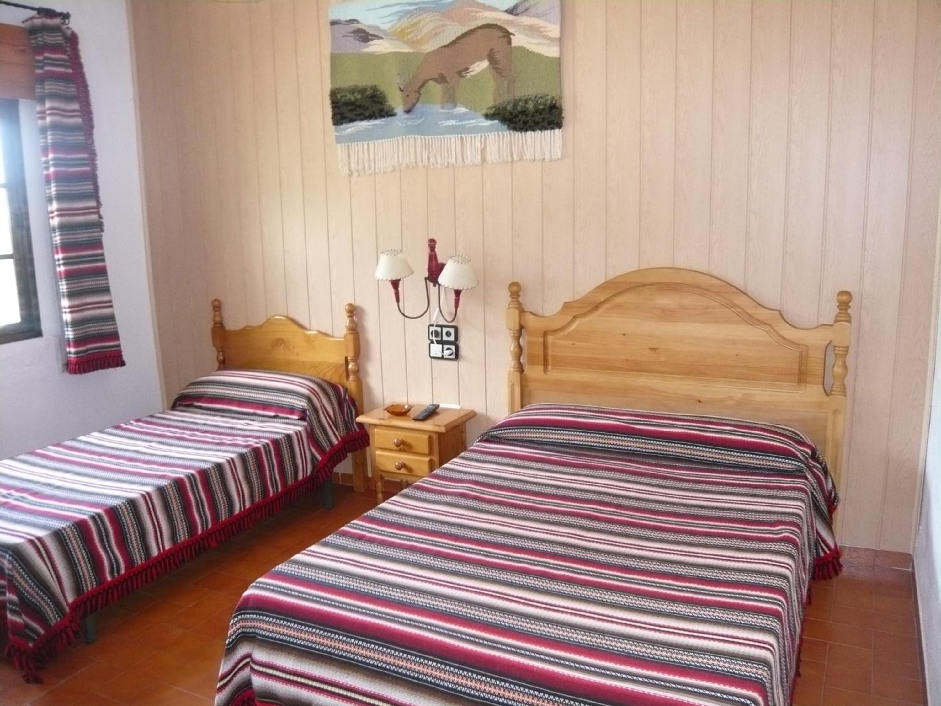 Habitación Triple con Vista a la Montaña