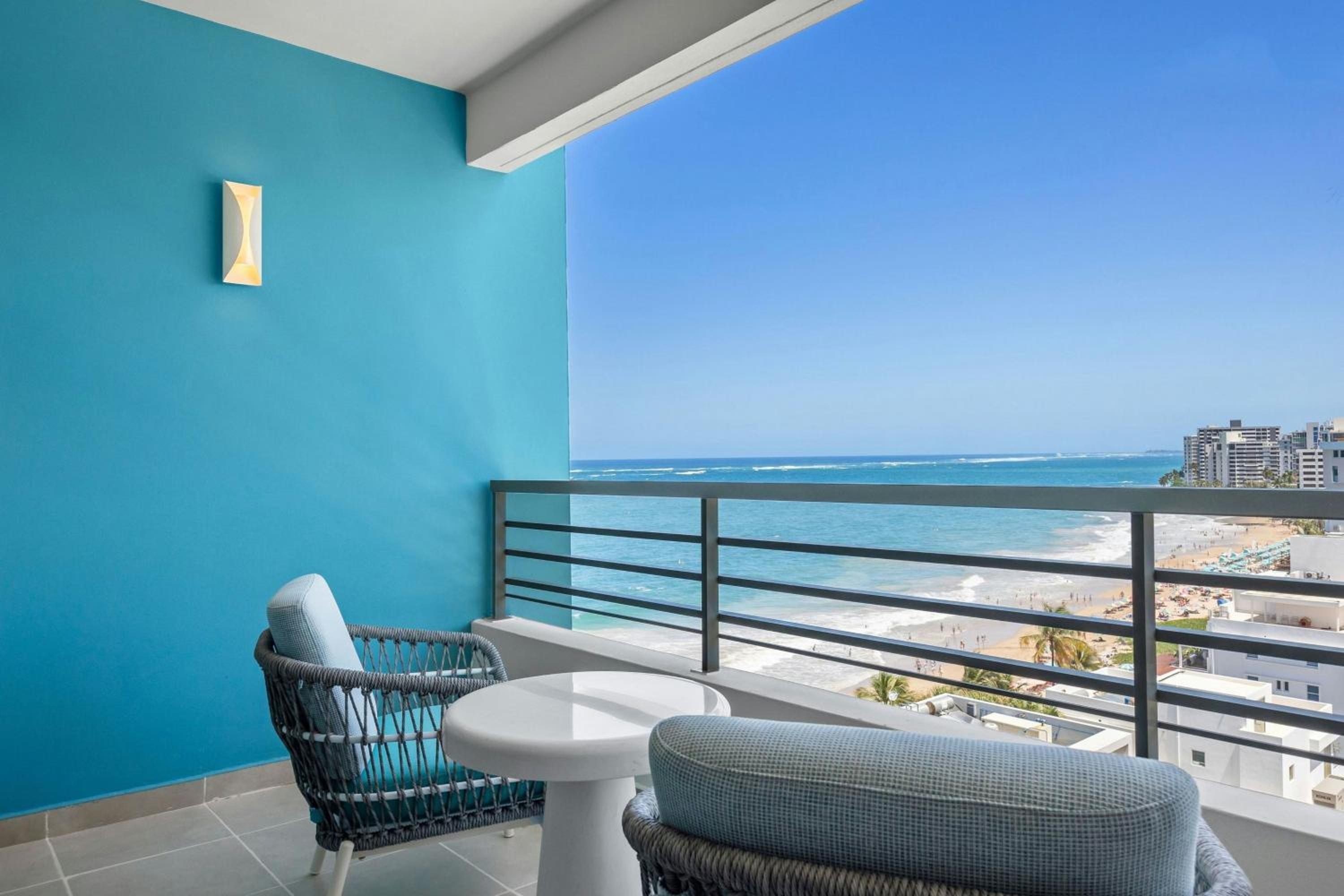 One-Bedroom Deluxe King Suite with Sofa Bed and Partial Ocean View