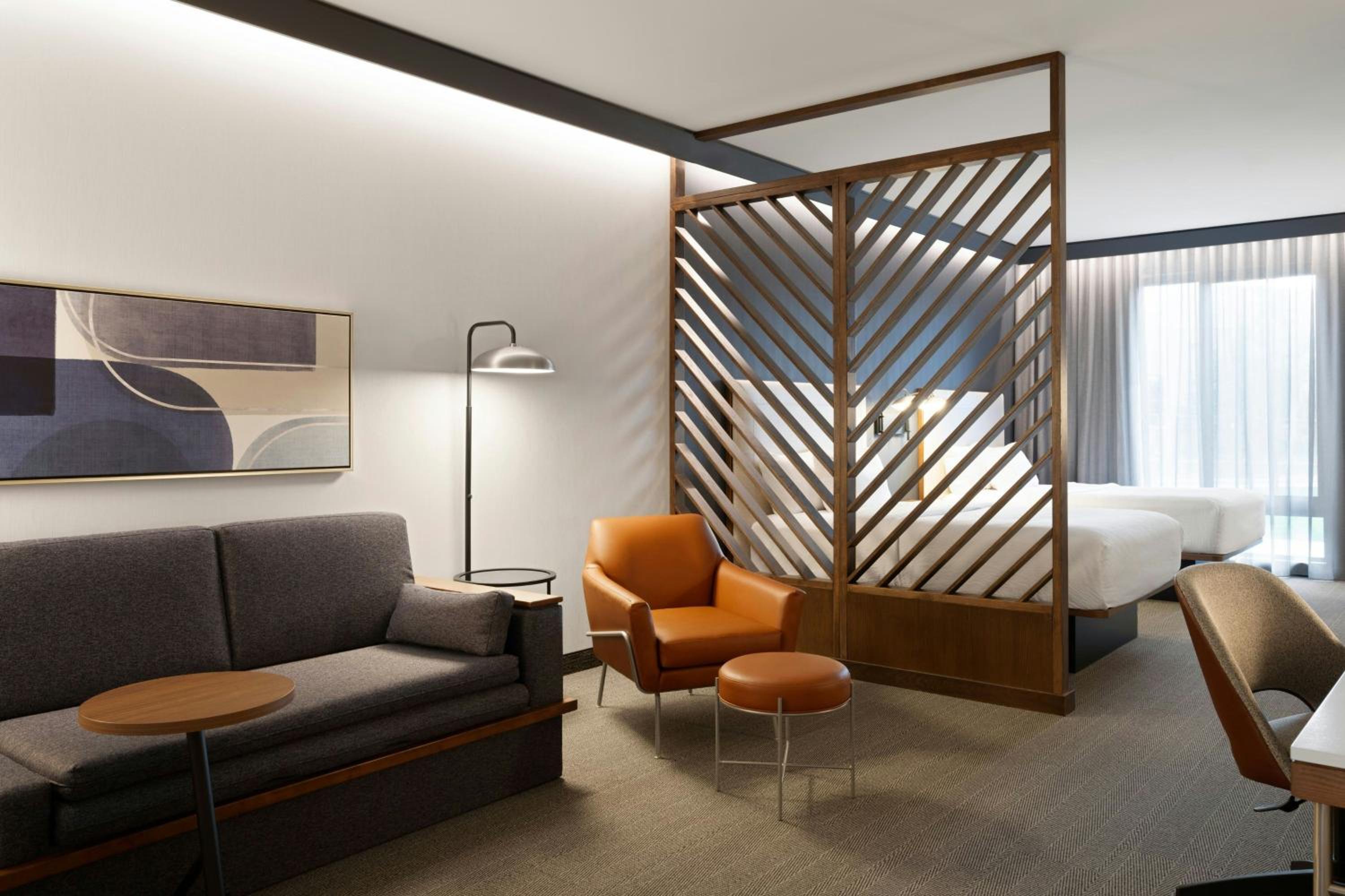 Queen Suite with Two Queen Beds, Roll-In Shower and Sofa Bed - Mobility Access photo 1