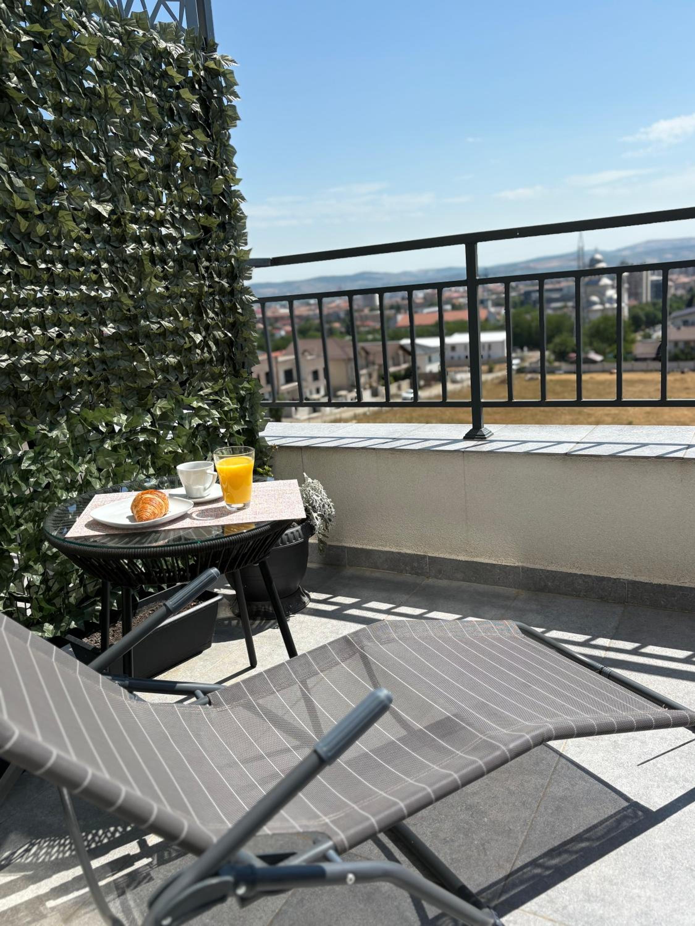 One-Bedroom Apartment with Balcony and City View