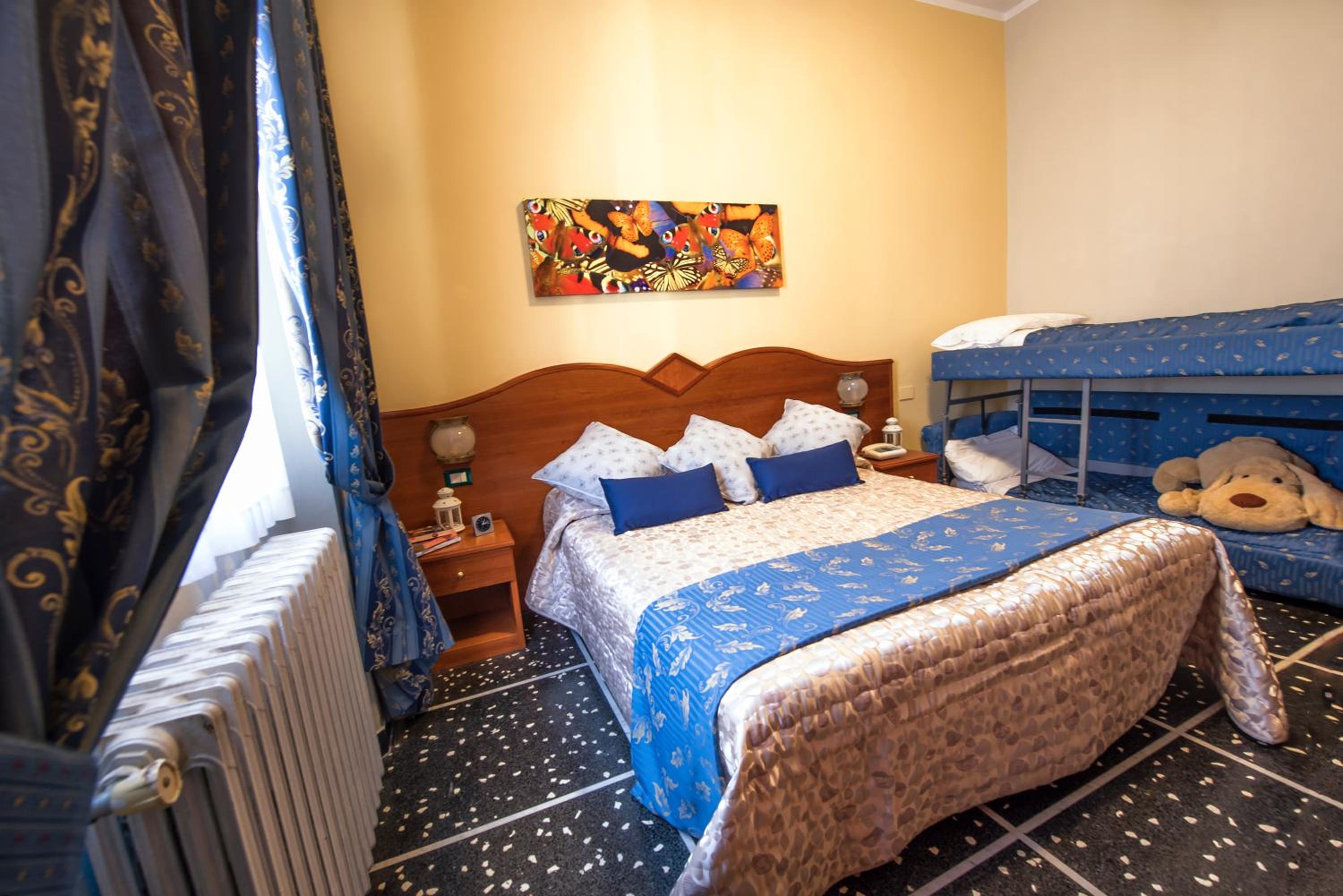 Quadruple Room (2 Adults + 2 Children) photo 2