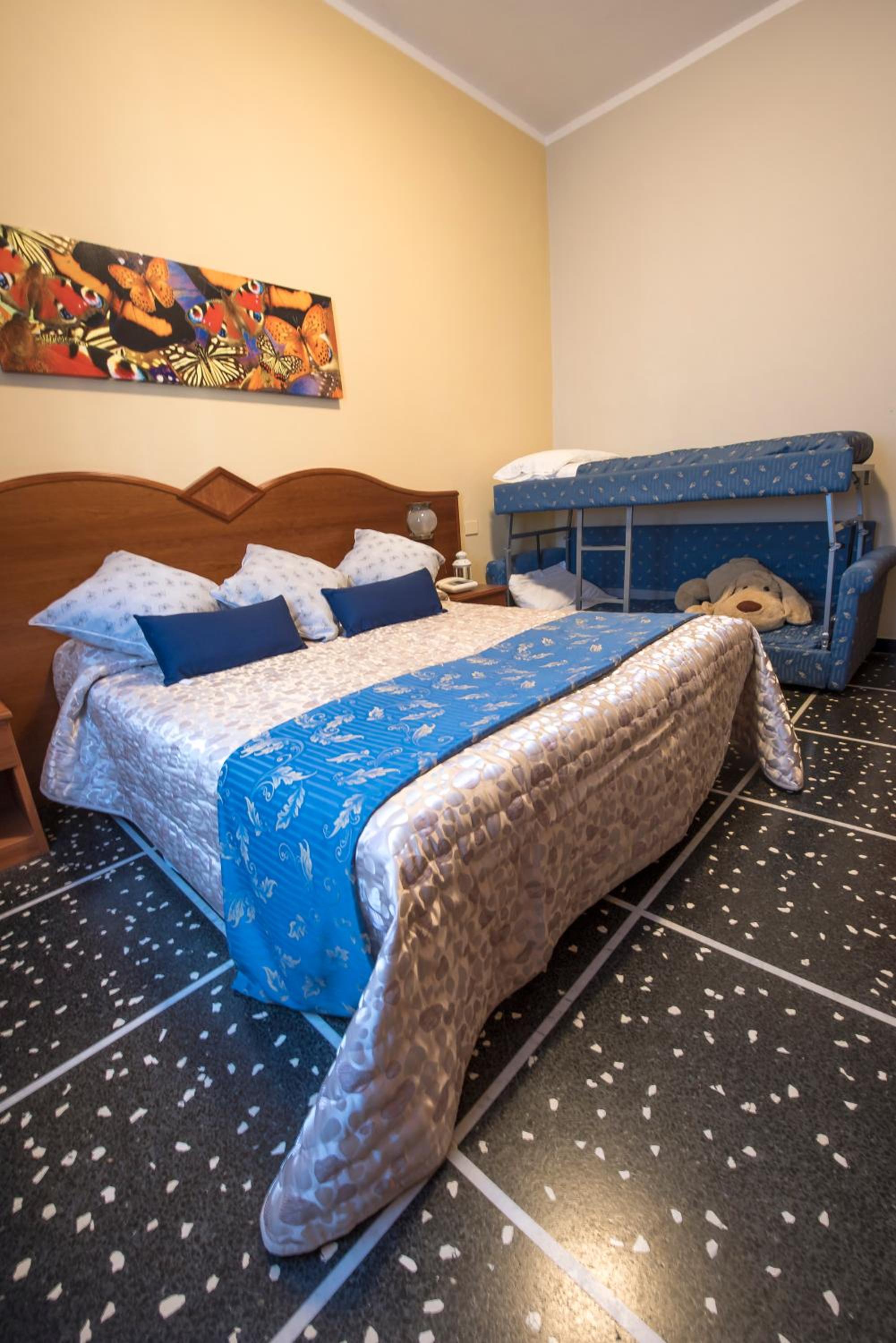 Quadruple Room (2 Adults + 2 Children)