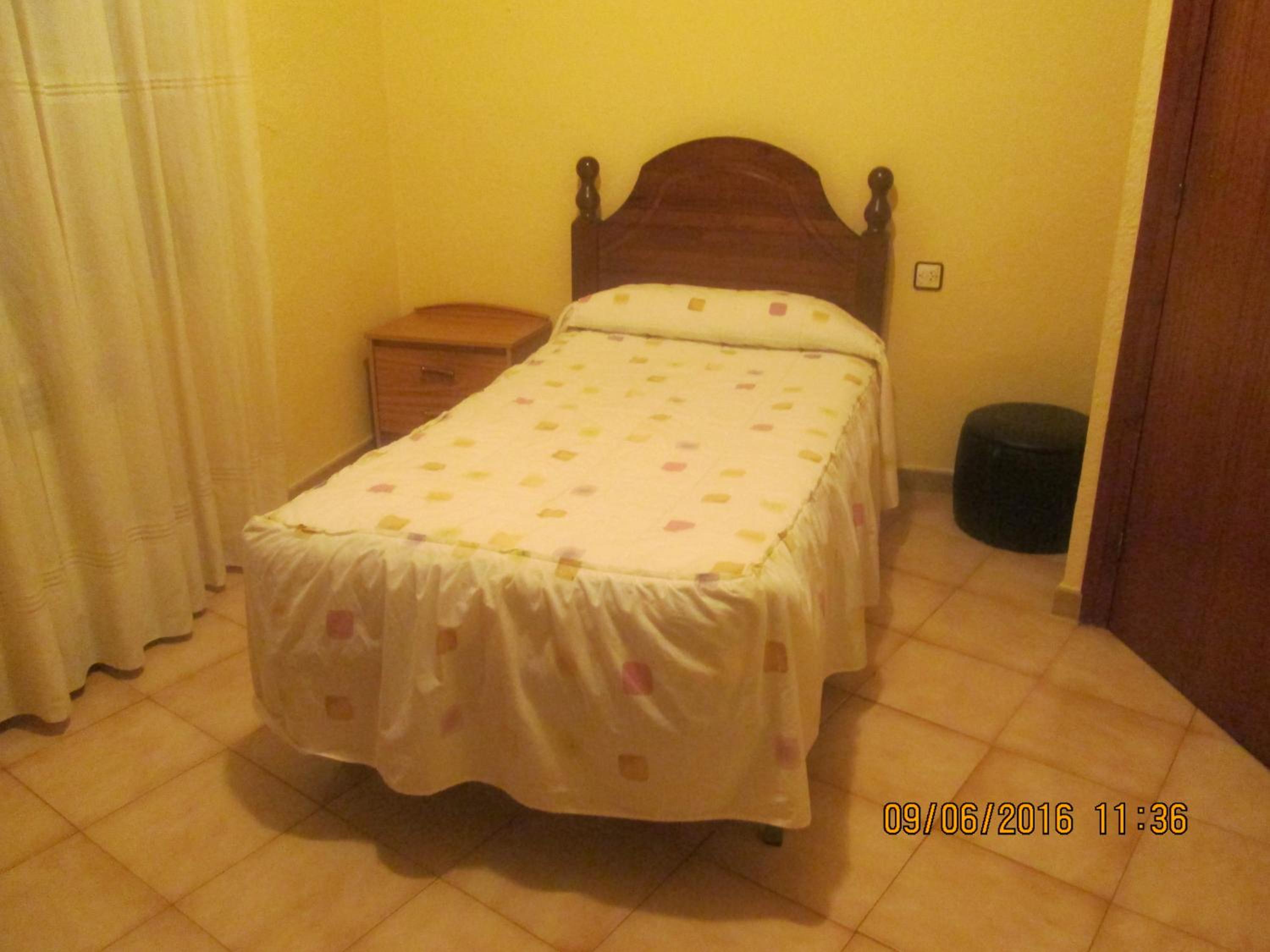 Habitación individual con baño compartido