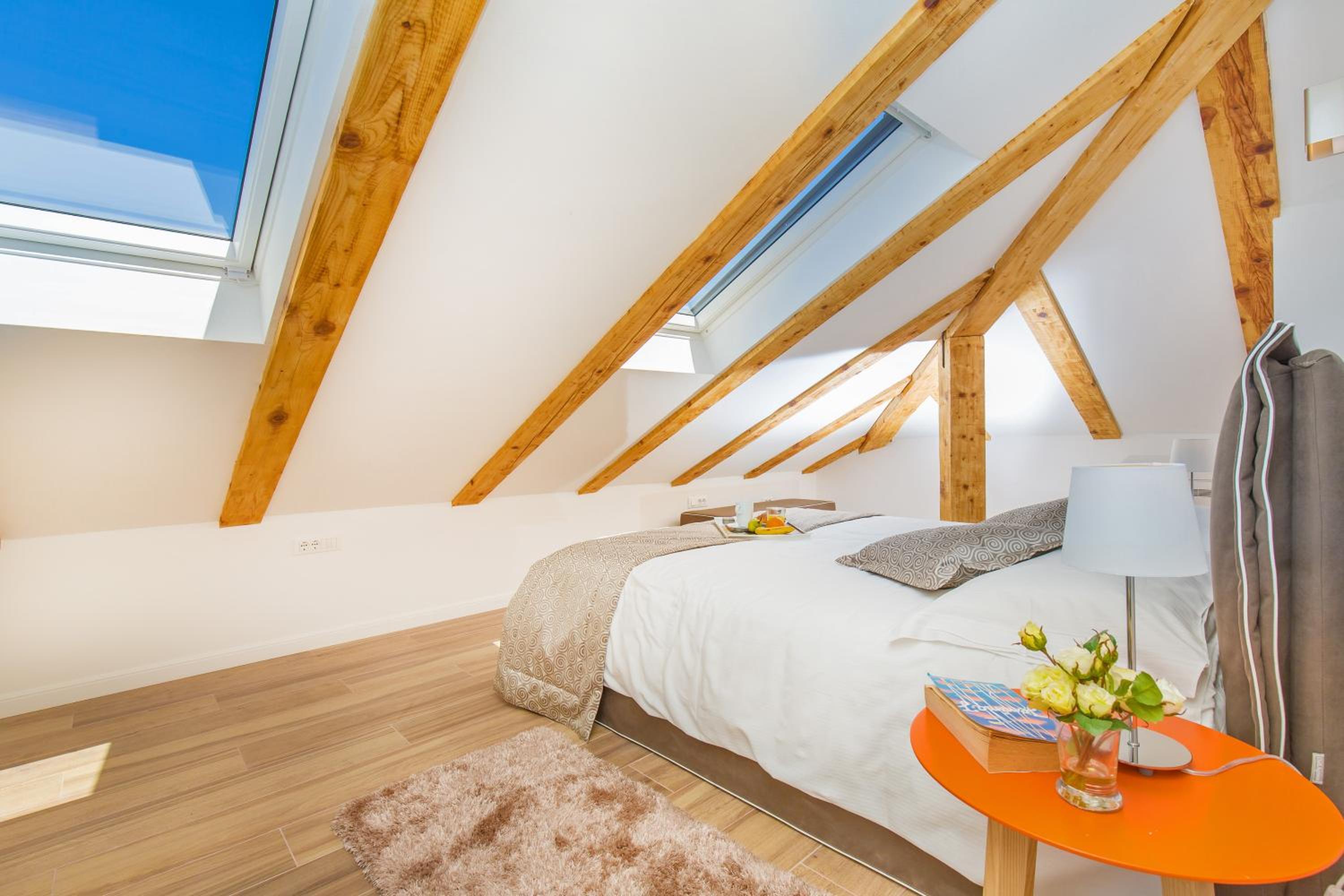 One-Bedroom Apartment with Balcony - Attic photo 2