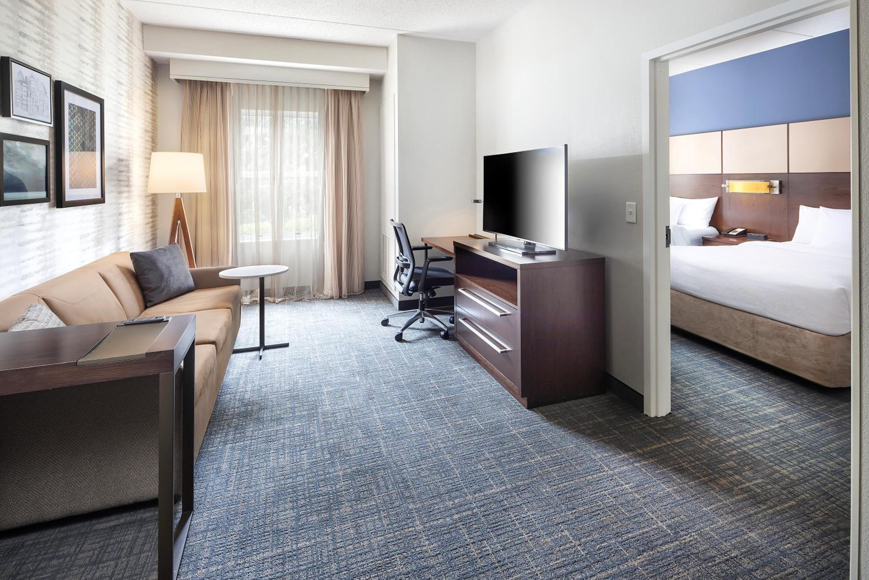 One-Bedroom Queen Suite with Two Queen Beds and Sofa Bed - Mobility and Hearing Accessible with Roll-in Shower