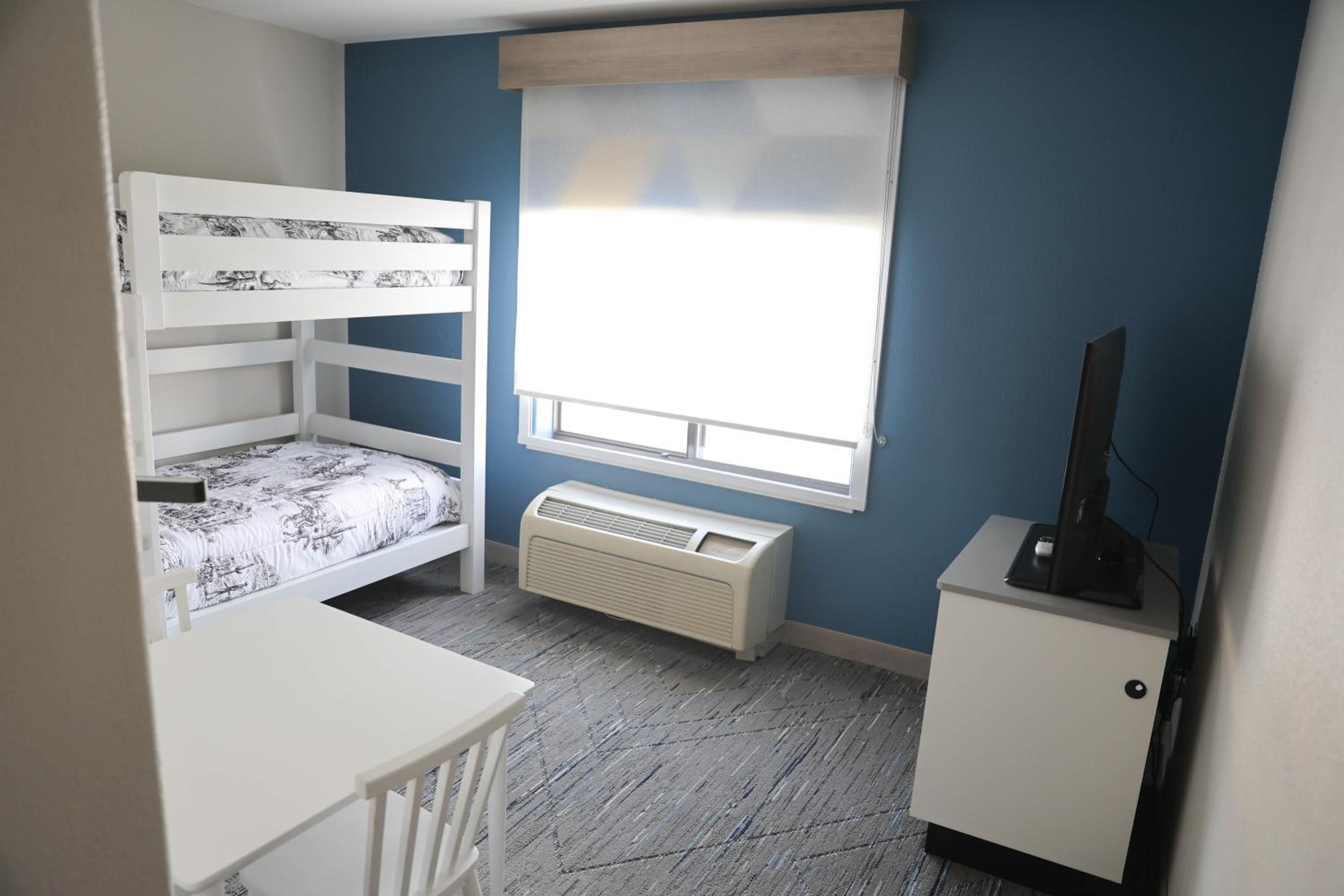Suite with One King Bed and One Twin Bed - Non-Smoking - Photo 1