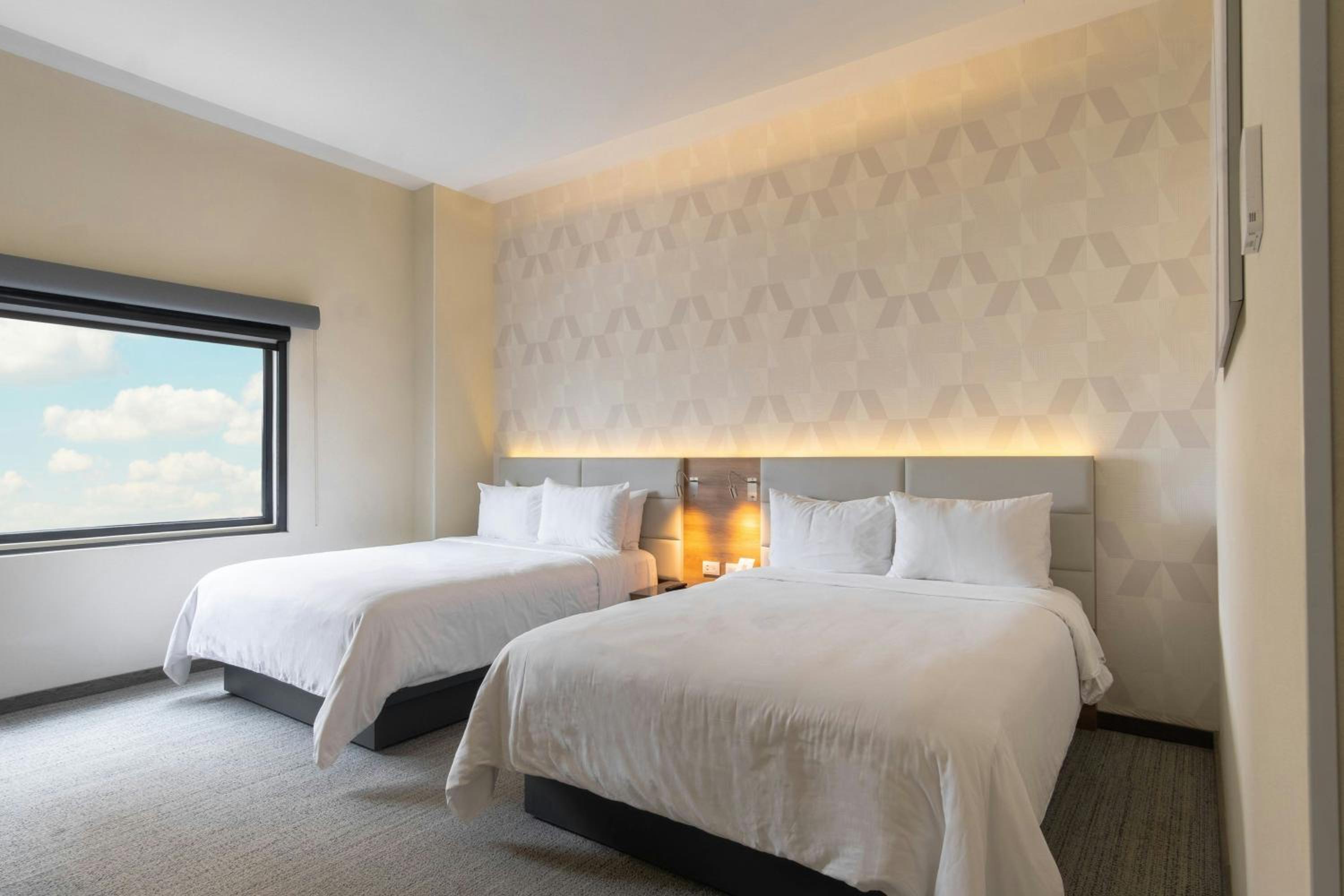 Standard Queen Room with Two Queen Beds - Photo 1