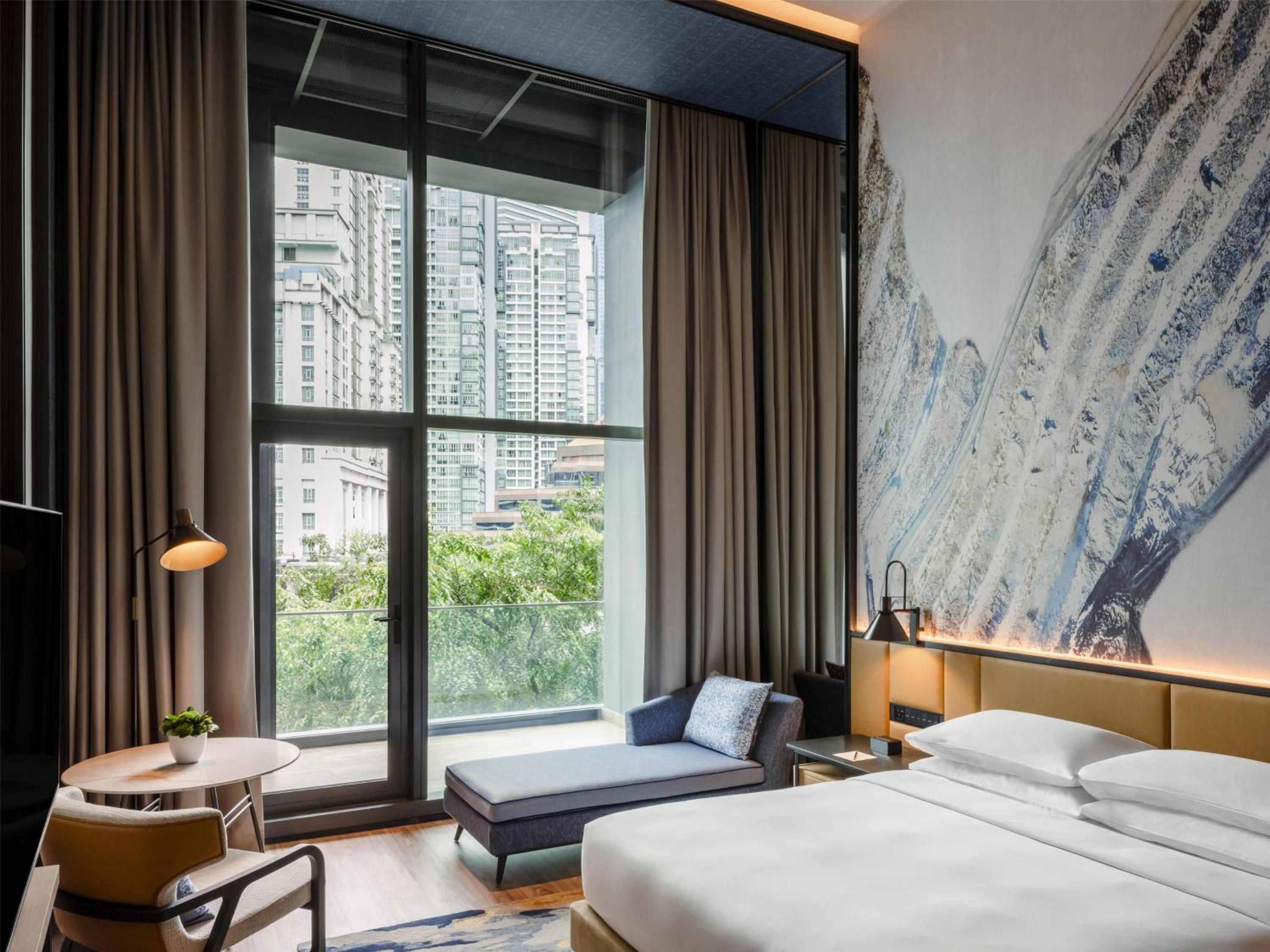 Deluxe King Room with City View and Balcony Deluxe King Room with City View and Balcony