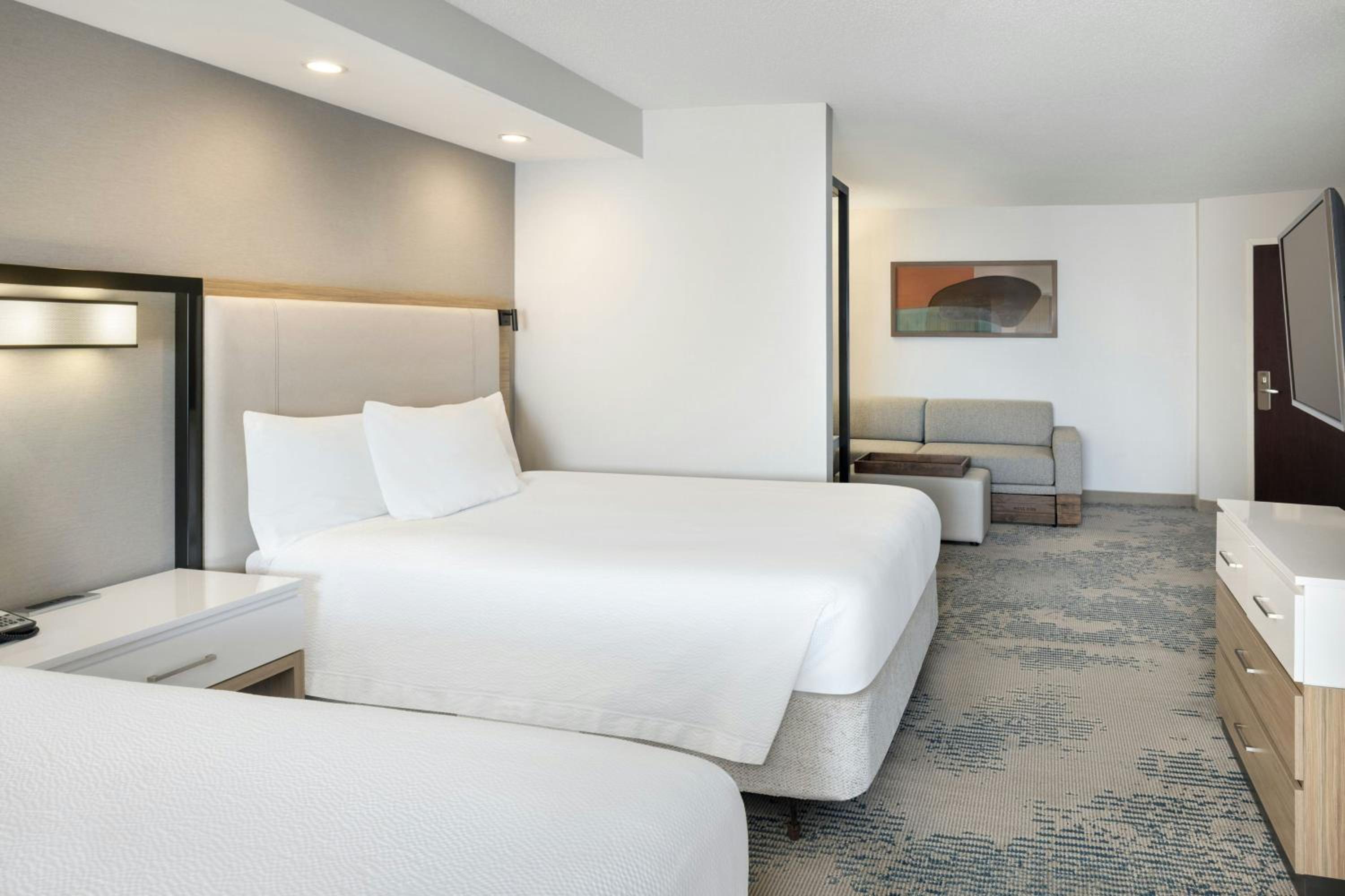 Queen Suite with Two Queen Beds and Trundle Sofa - Photo 2