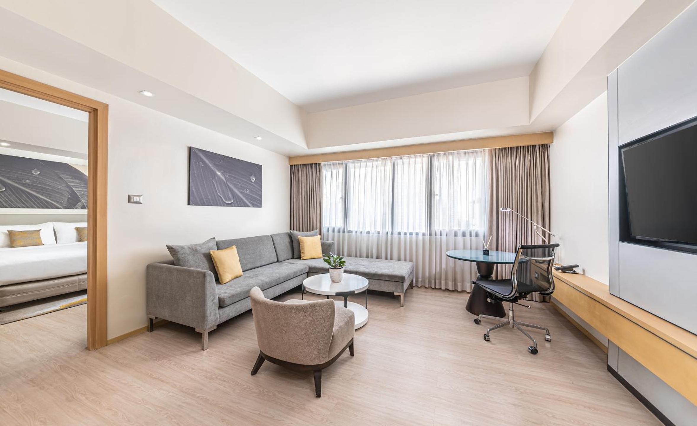1 King Bed, One-Bedroom Large Suite with Living Area and Lounge Access - Photo 1