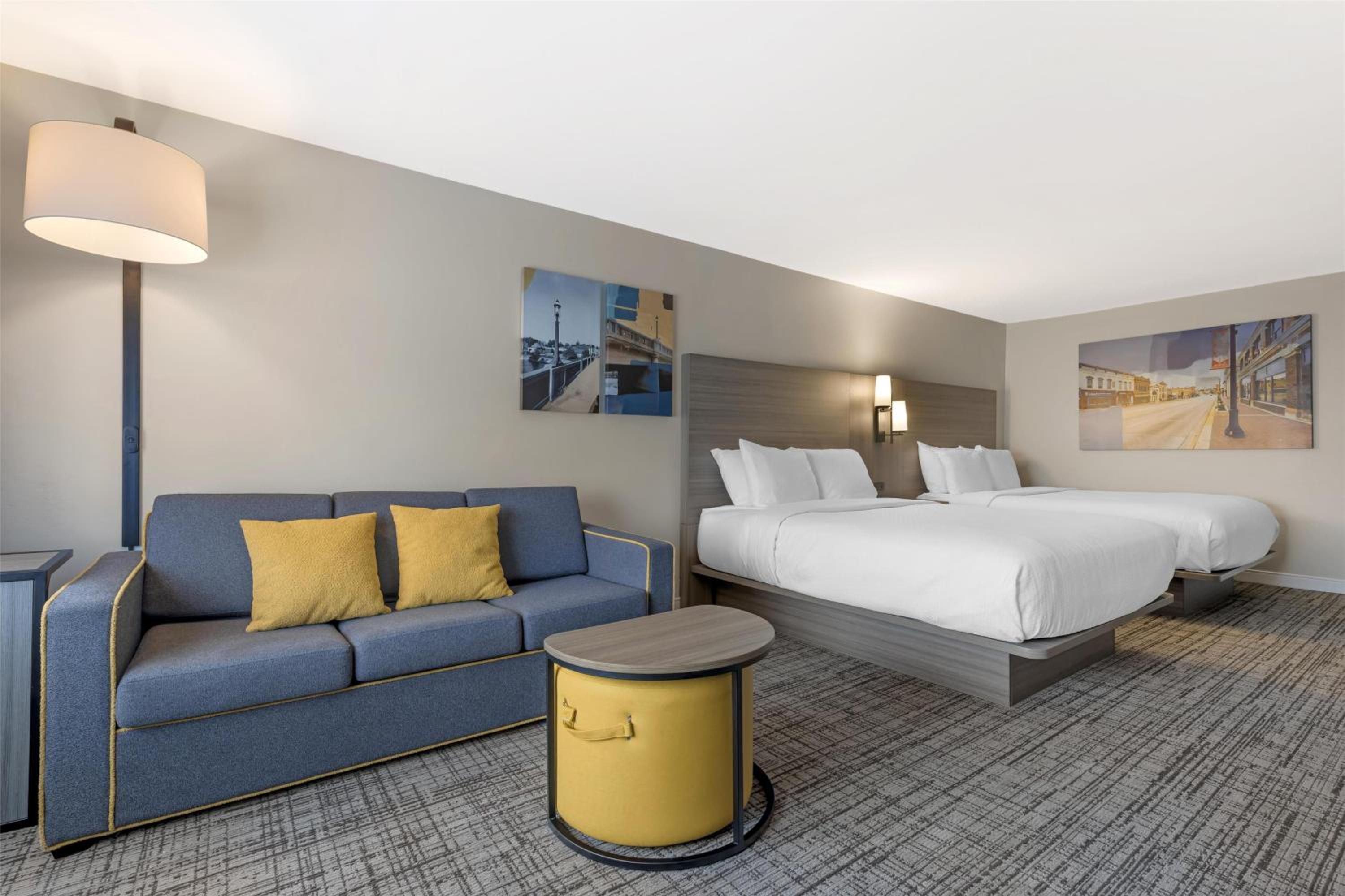 Queen Room with Two Queen Beds and Sofa Bed - Photo 1