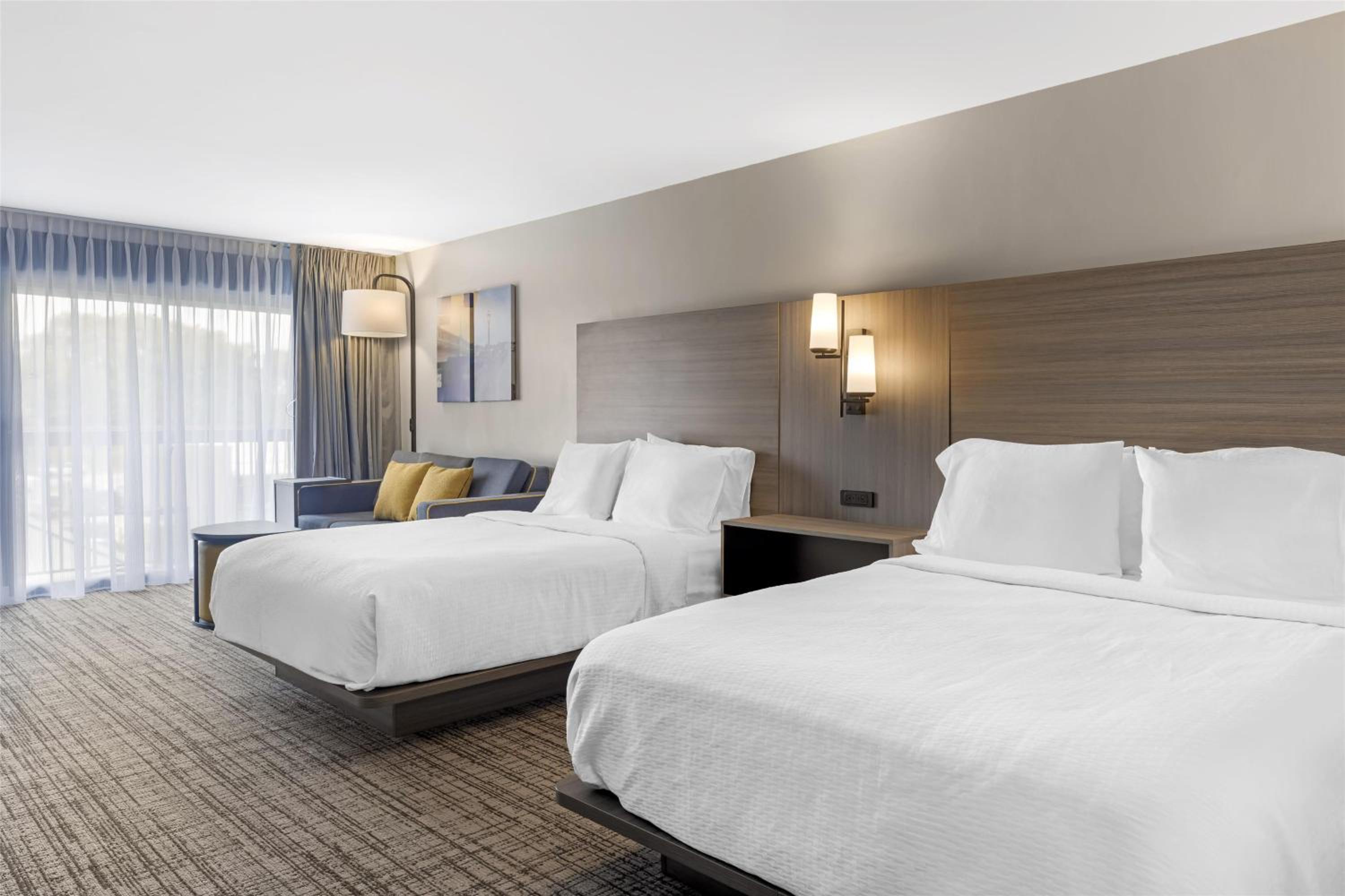 Queen Room with Two Queen Beds and Sofa Bed - Bath Tub/Disability Access - Photo 1
