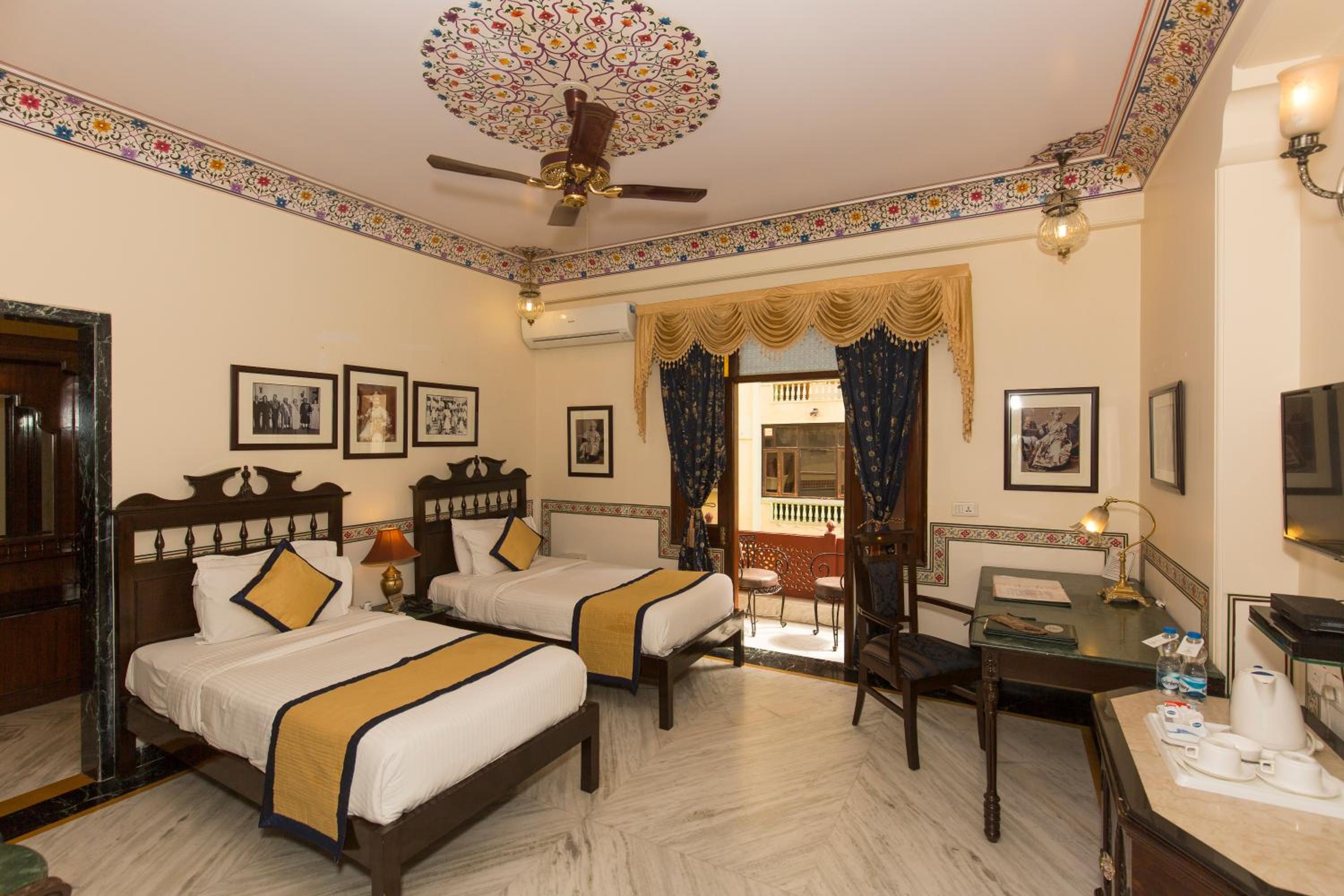 Royal Deluxe Family: Free pickup from train or bus station on arrival. Enjoy daily Rajasthani dance & music (7PM–9 PM), swimming pool, kids stay free, and a dedicated travel desk to assist with local sightseeing tours, intercity travel and activities - Photo 9