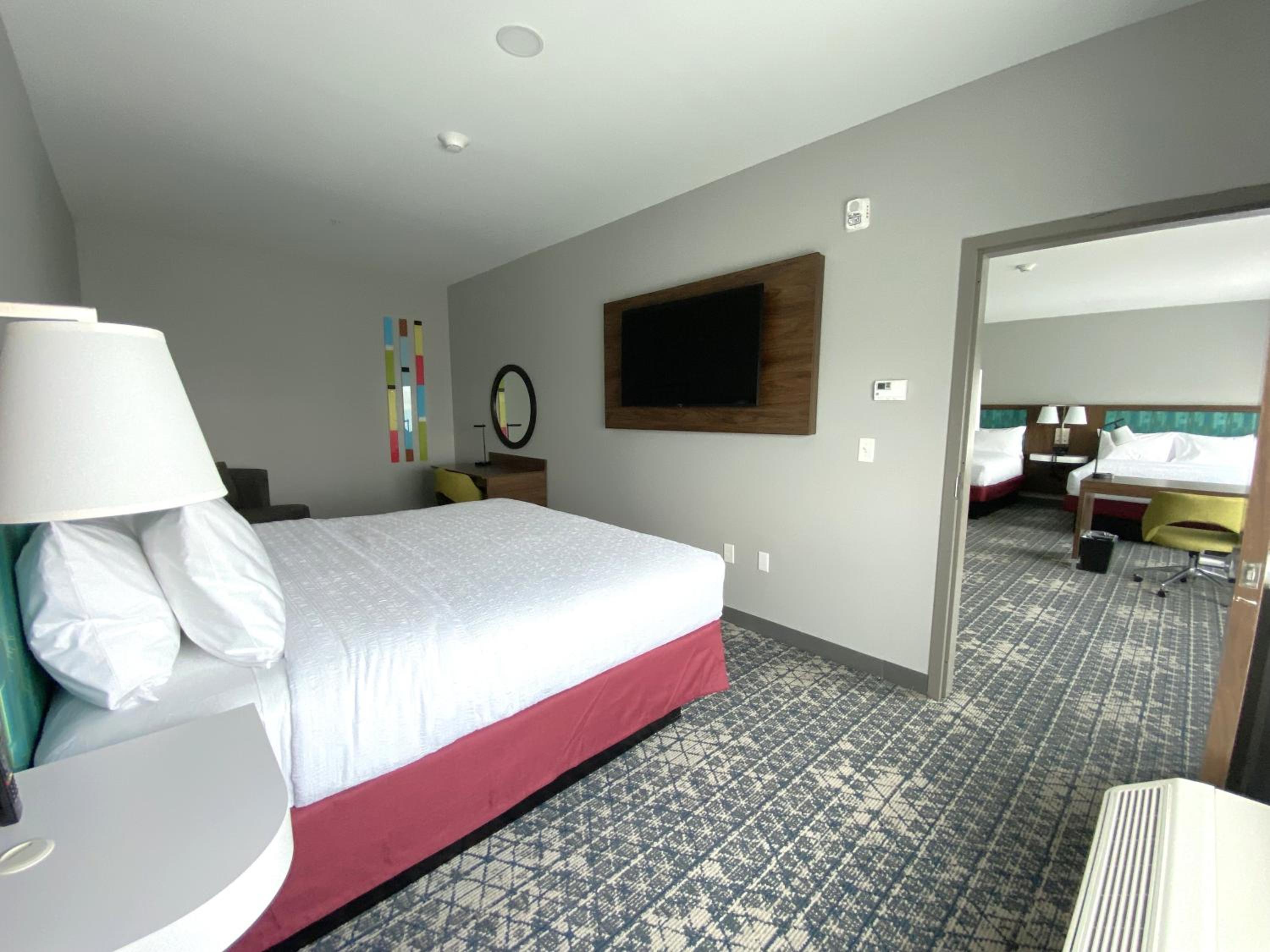 Two Room Suite with One King and Two Queen Beds - Photo 4
