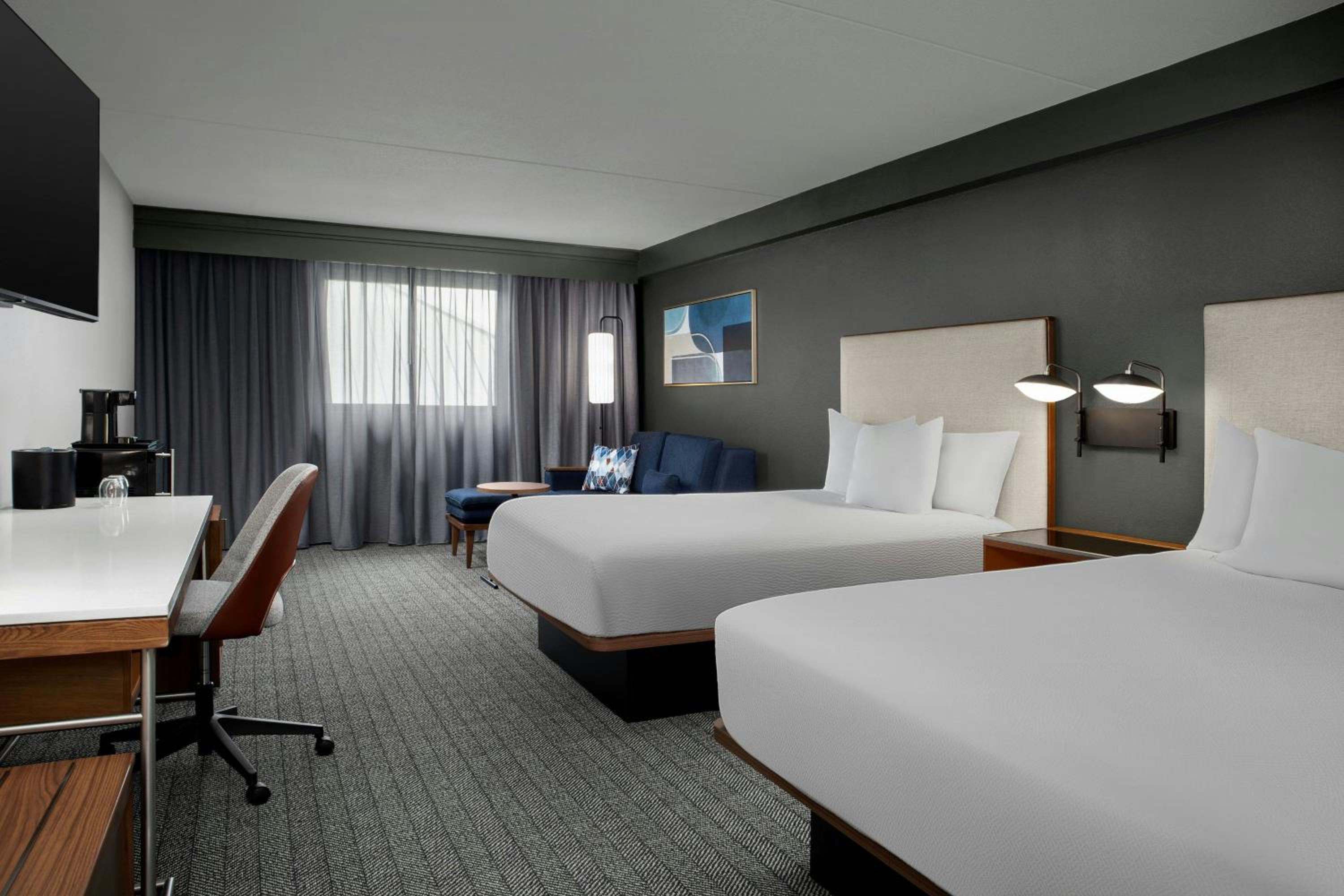 Queen Room with Two Queen Beds and Sofa Bed - Mobility Accessible with Tub photo 1