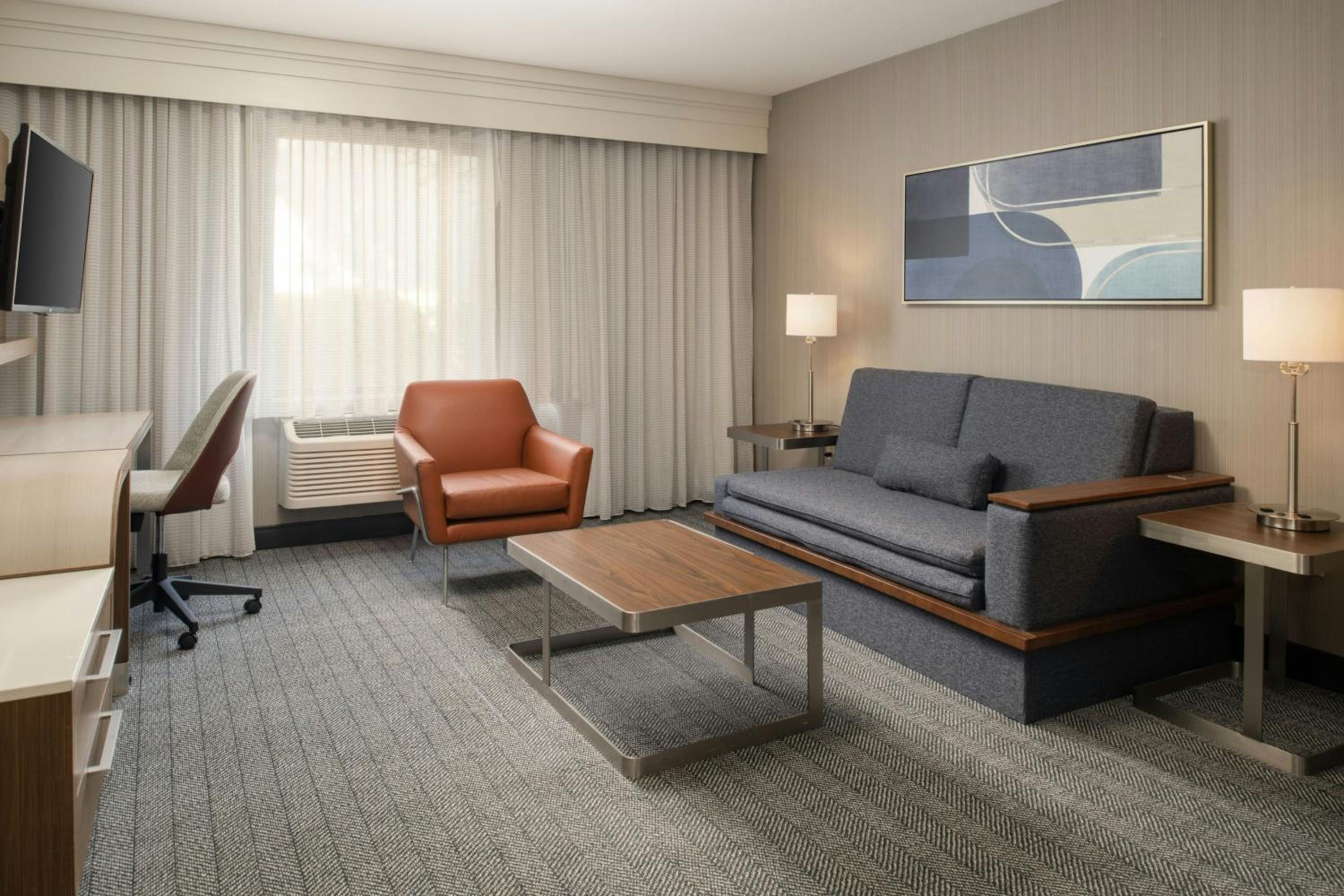 King Suite with Sofa Bed and Adapted Tub - Mobility and Hearing Accessible - Photo 1