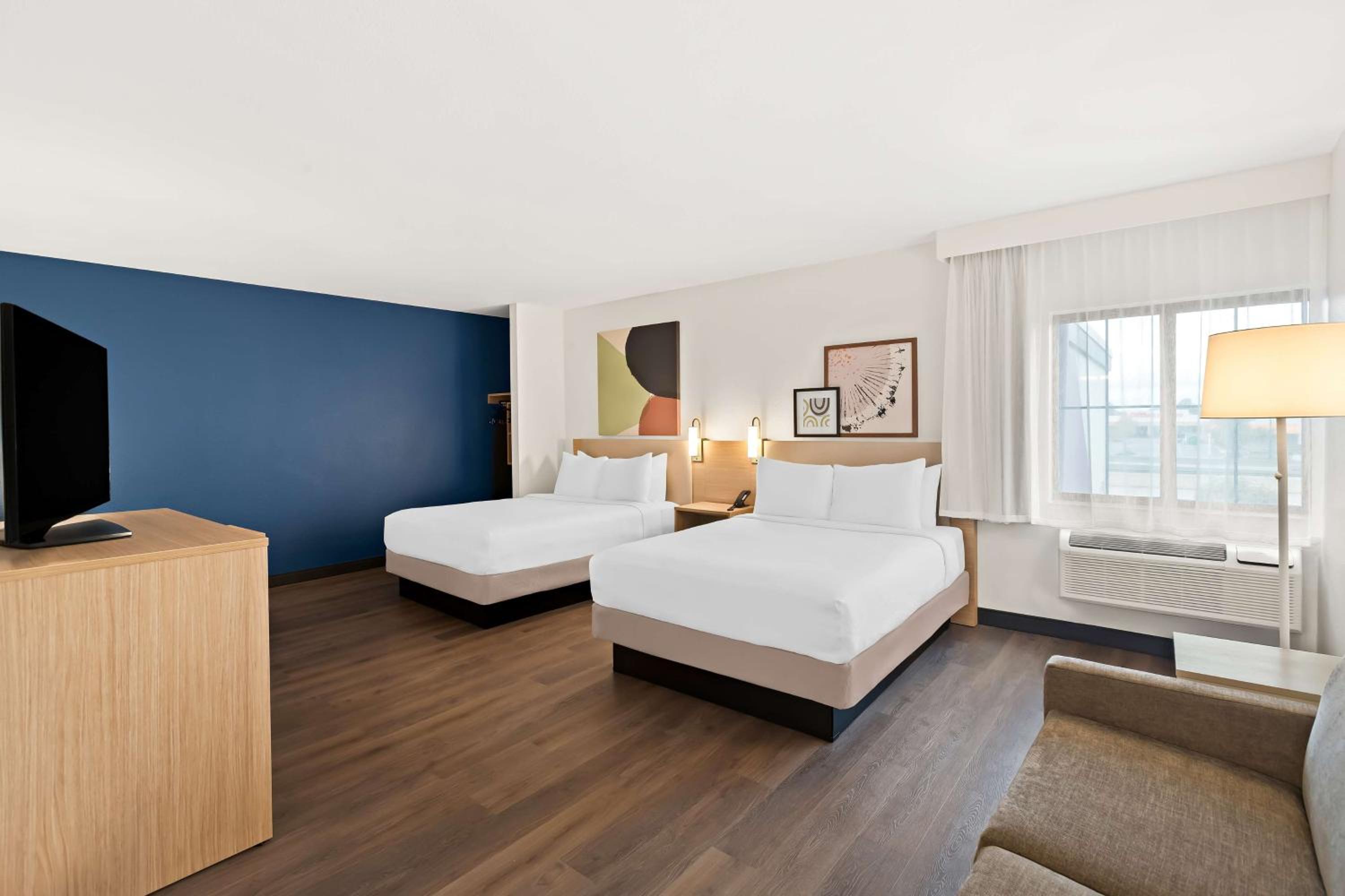 Queen Room with Two Queen Beds and Sofa Bed - Photo 1