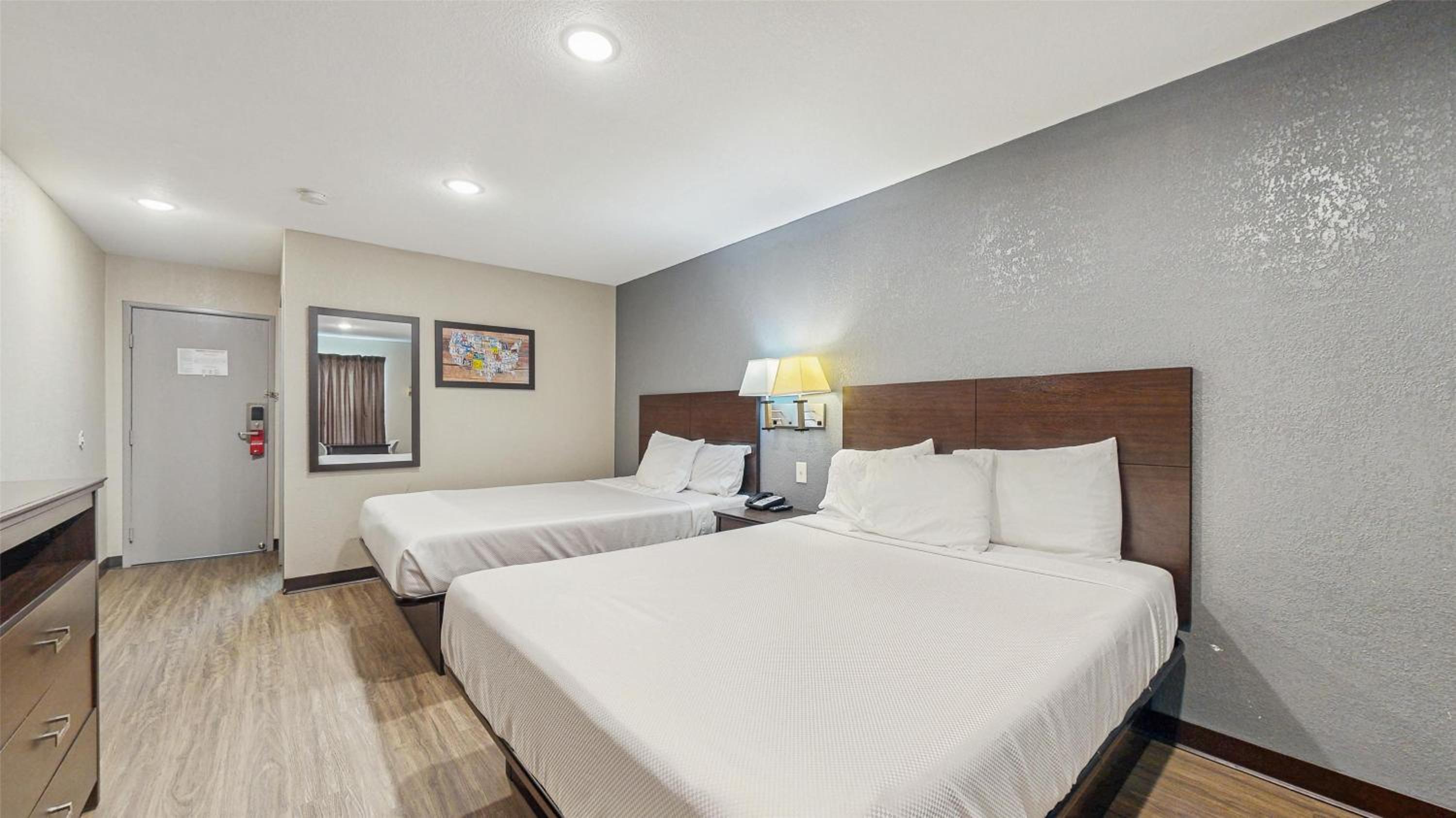 Suite, 2 Queen Beds with Sofa bed, Smoking, Refrigerator & Microwave - Photo 1