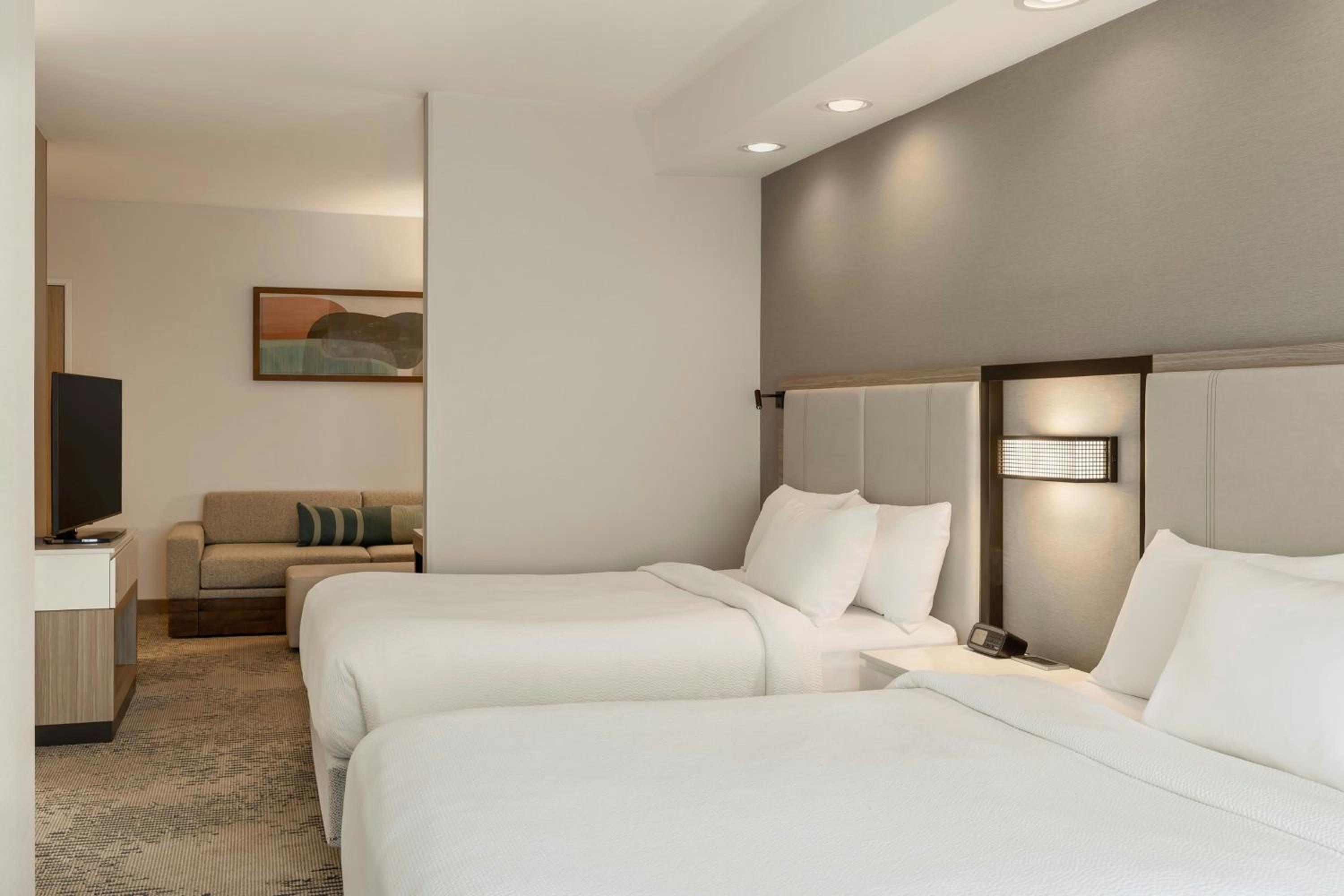 Queen Suite with Two Queen Beds and Trundle Sofa - Photo 1