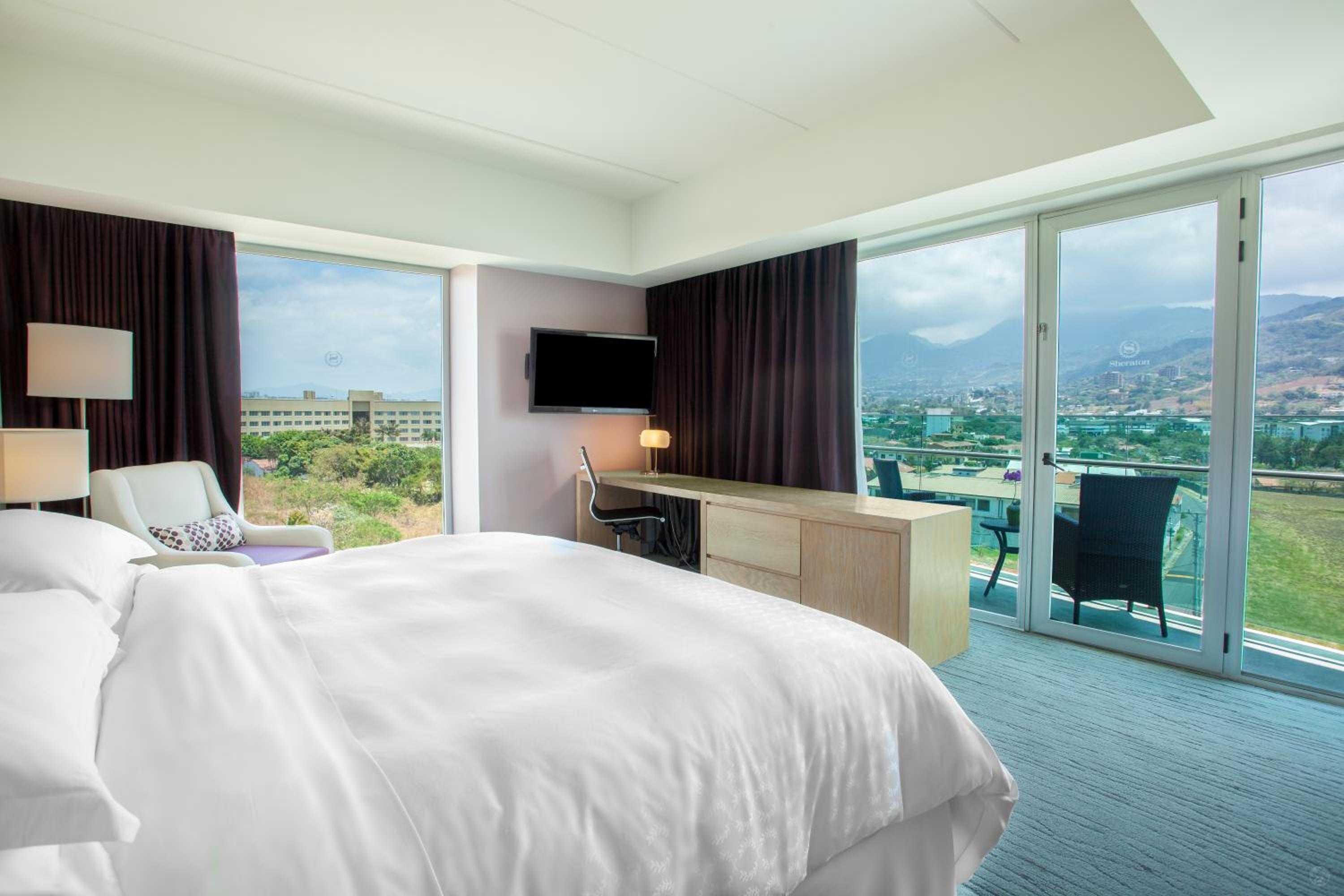 Larger Deluxe King Room with One King Bed and Balcony - Mountain View/Club Access/Rain Shower