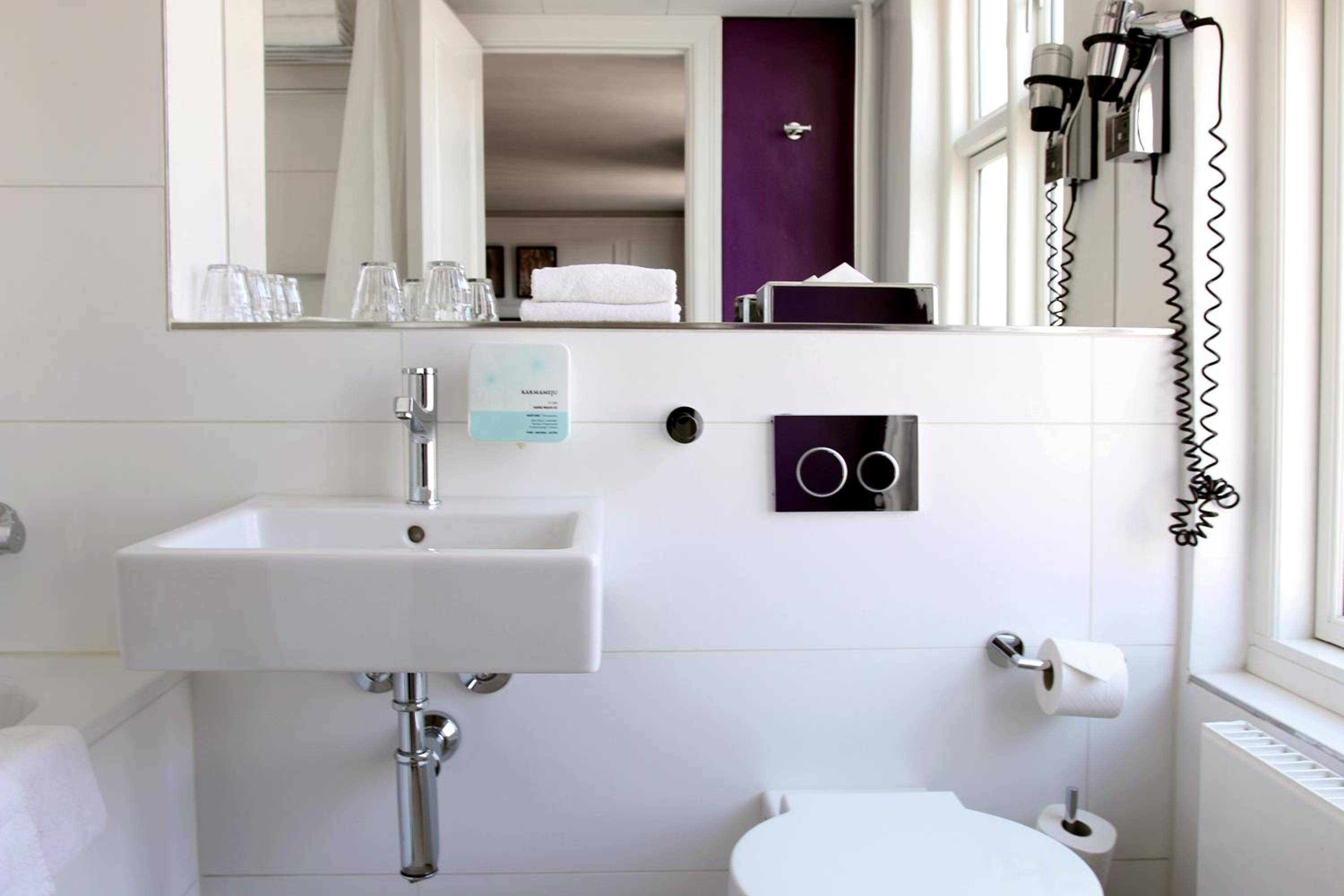 Experience relaxation in our stylish modern bathroom.