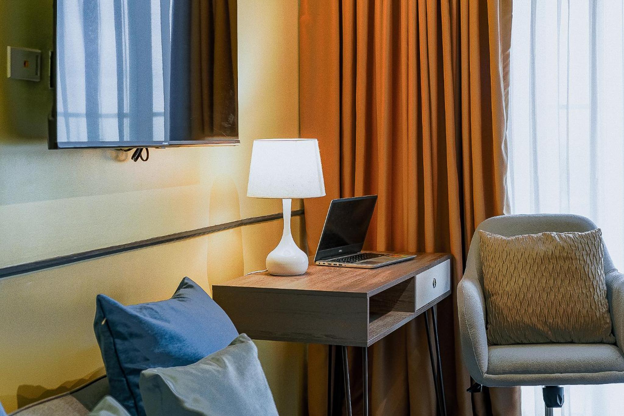 One-Bedroom Apartment with Balcony and City View