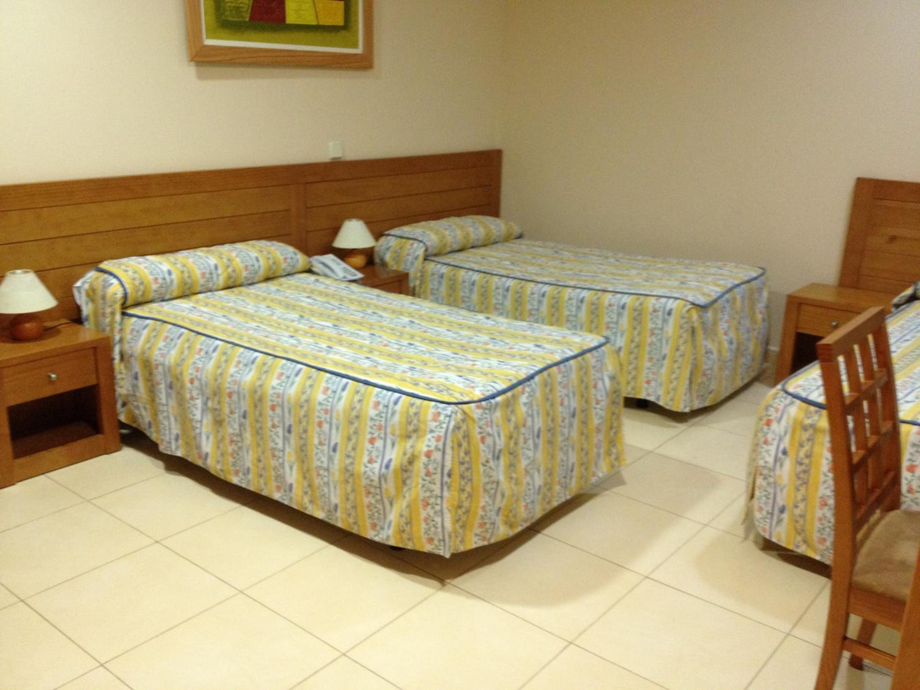 Habitación Triple con 3 Camas Individuales
