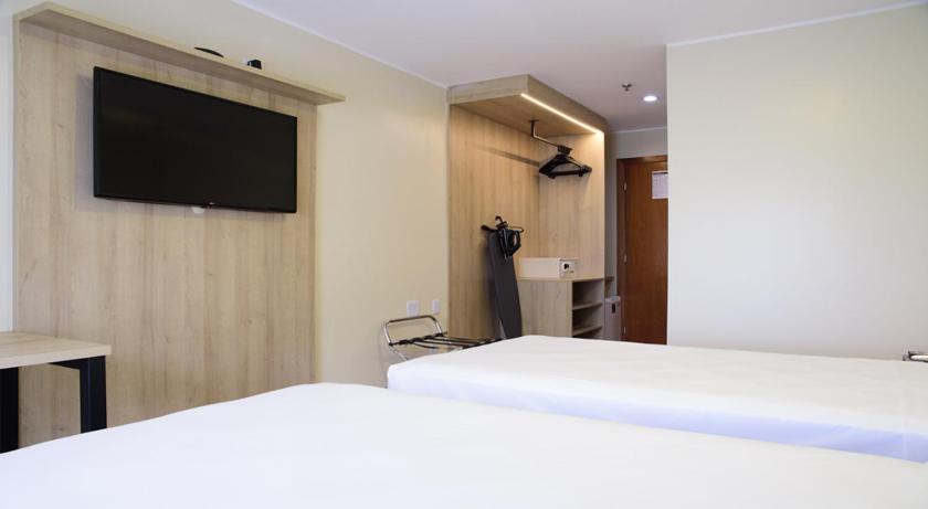 Quarto Deluxe com duas camas de solteiro” photo 2