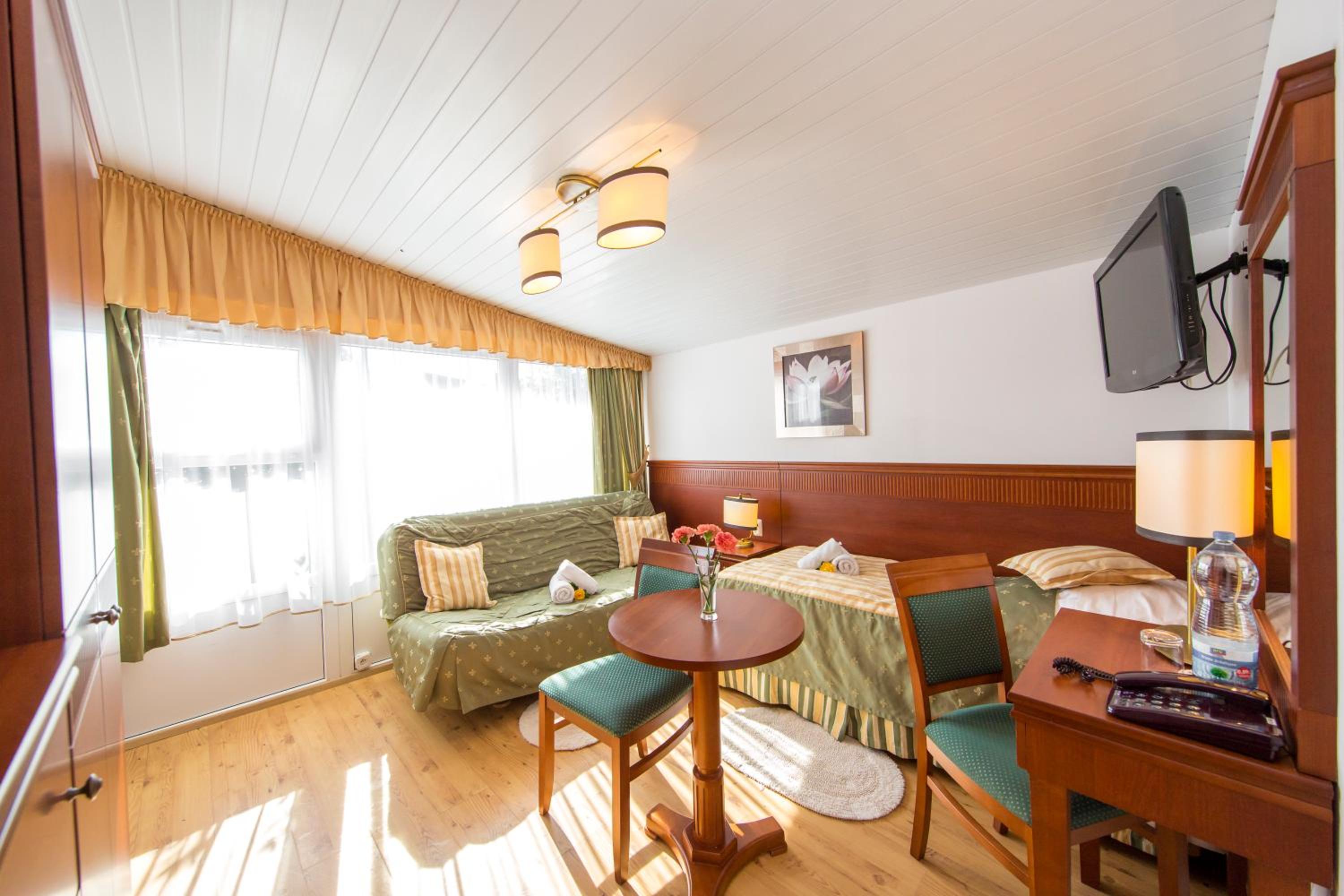 Family Bungalow with double bed, single bed and sofa