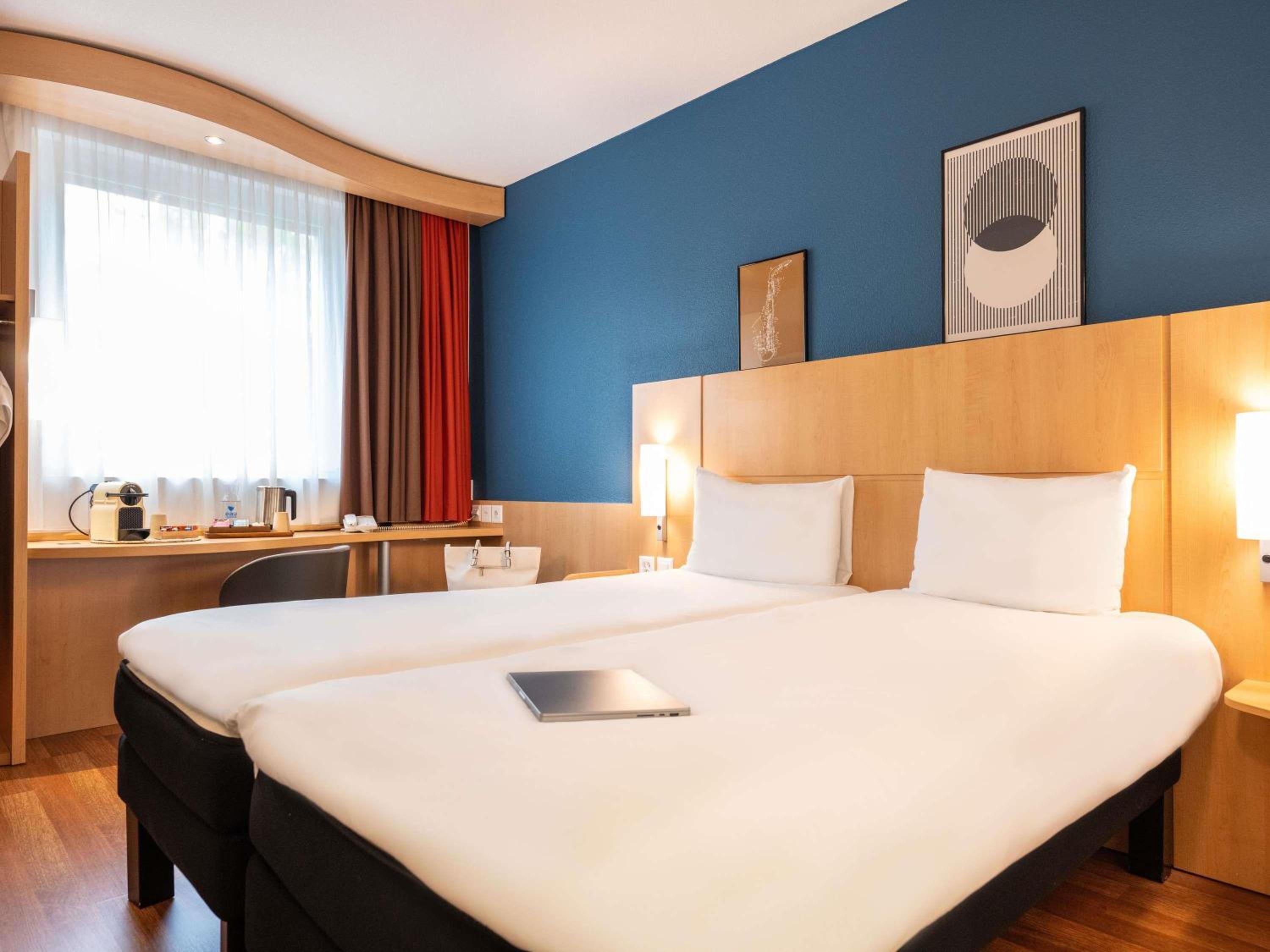 Standard Room with One Queen Bed and Two Single Beds
