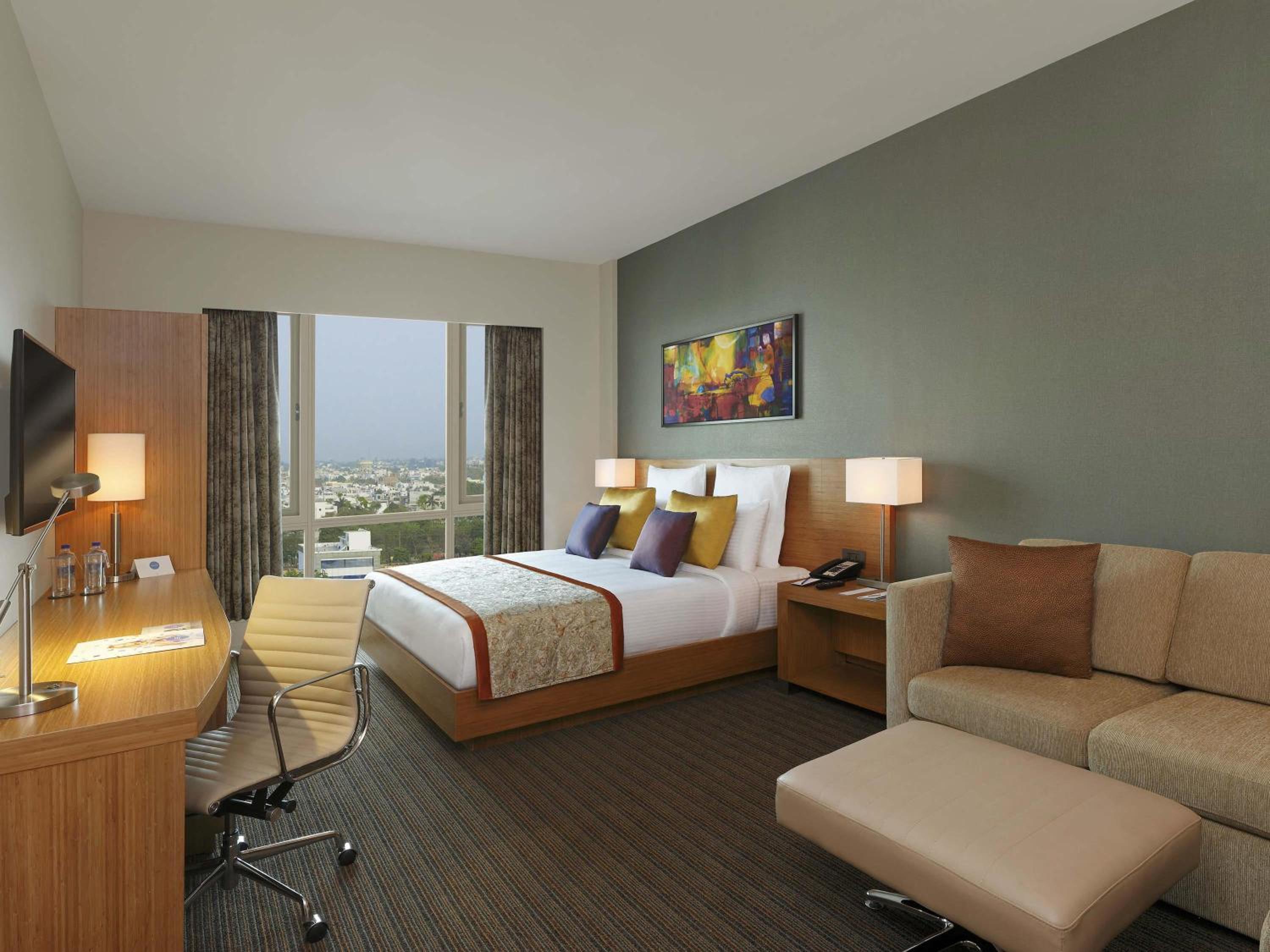 Premium King Room | Unlimited IMFL at the Premium Lounge from 6–8 pm, plus 20% discount on F&B, Laundry, Spa and Transport