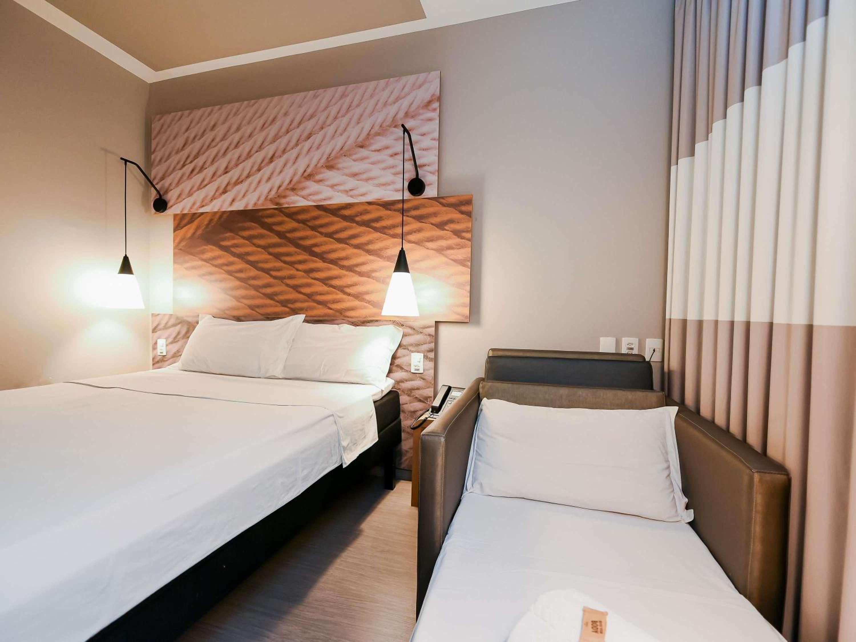 Standard Room with double bed and sofa