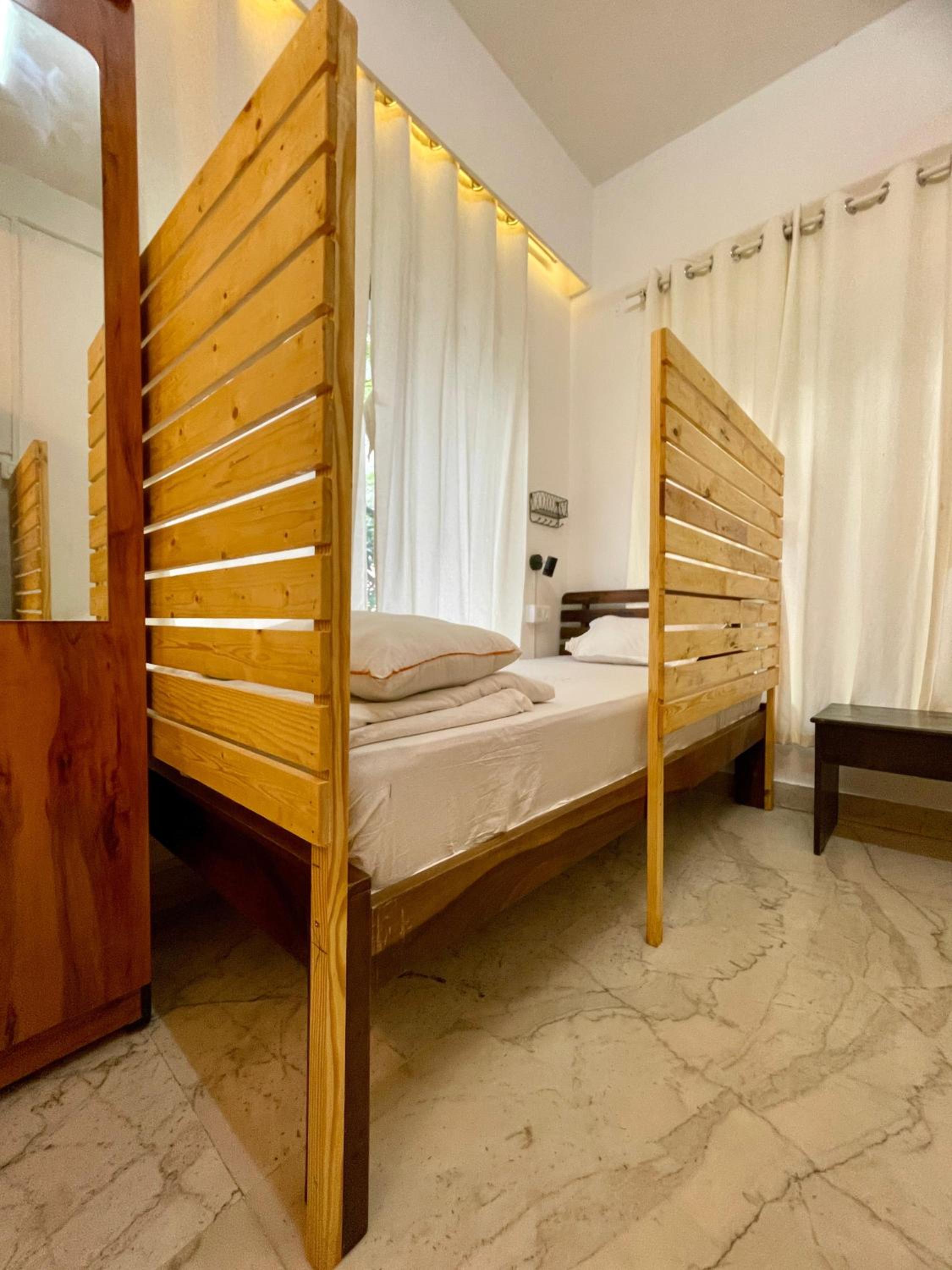 Single Bed in Dormitory Room