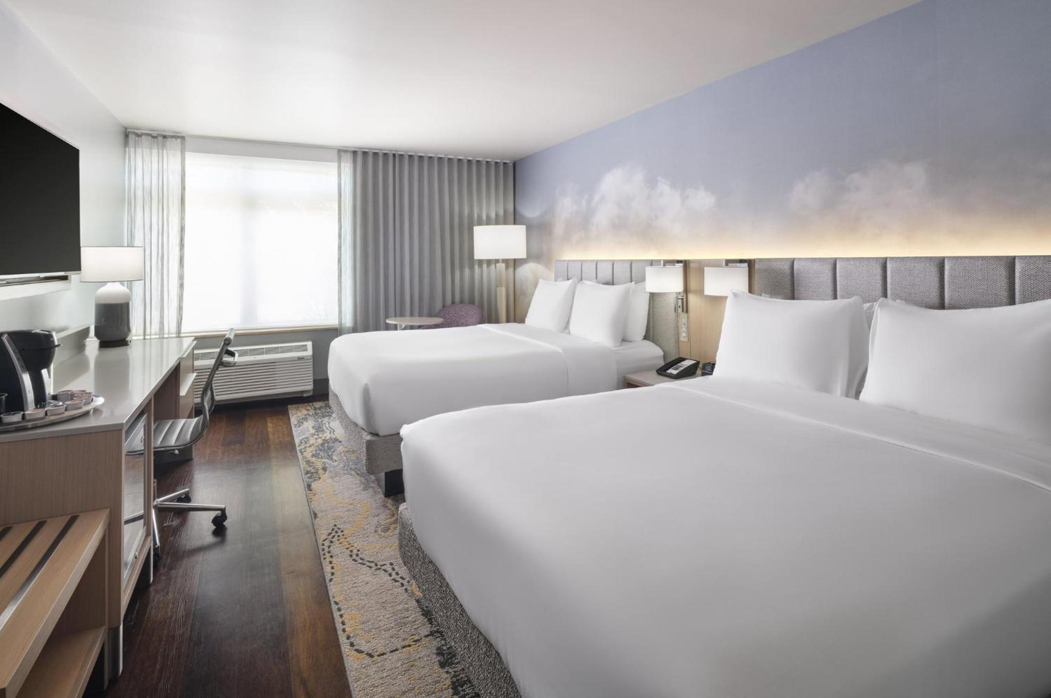 Queen Room with Two Queen Beds and Mobility Accessible Roll-In Shower photo 1