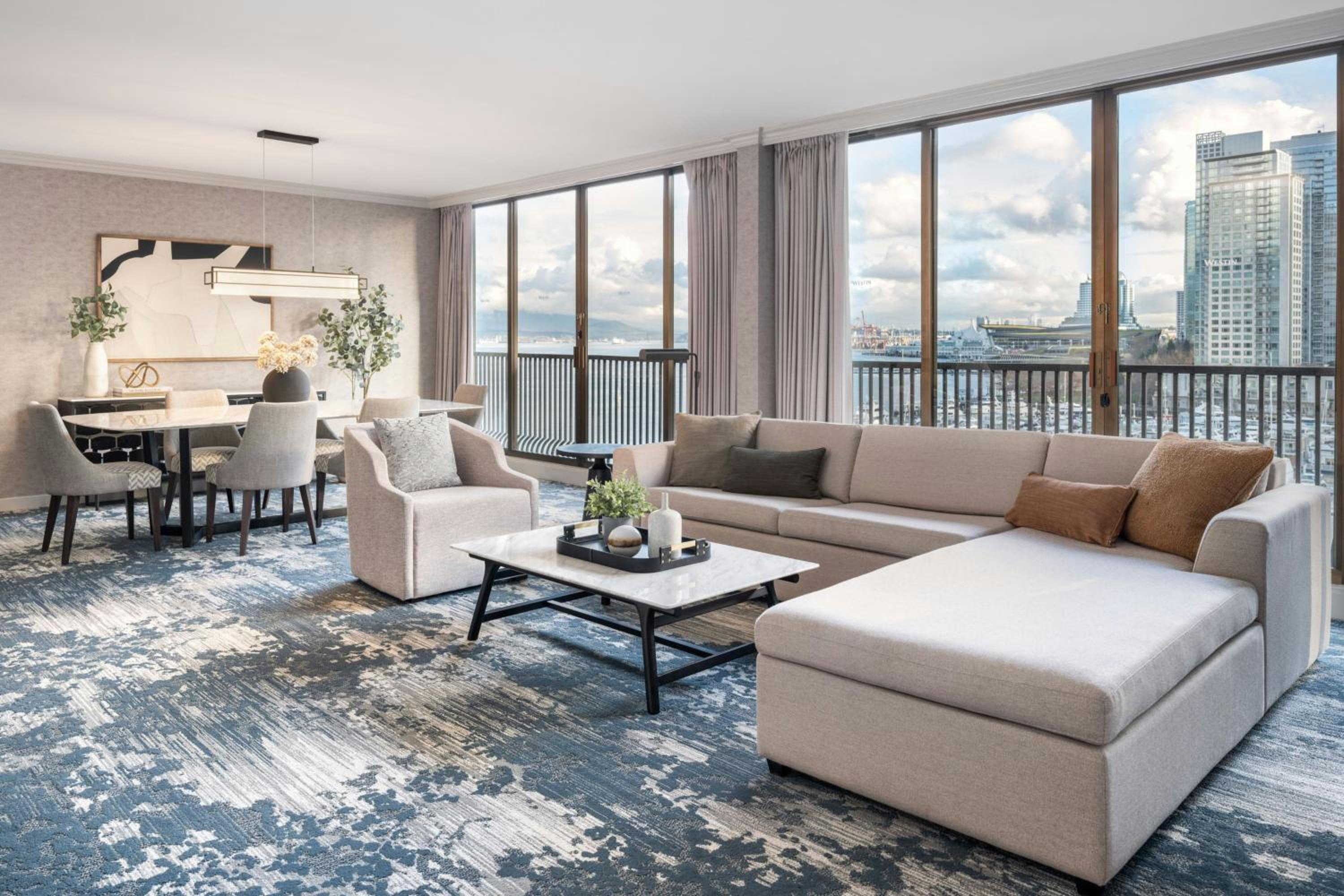 One-Bedroom King Suite with Harbor View, Living Room, Dining Area and Sofa Bed