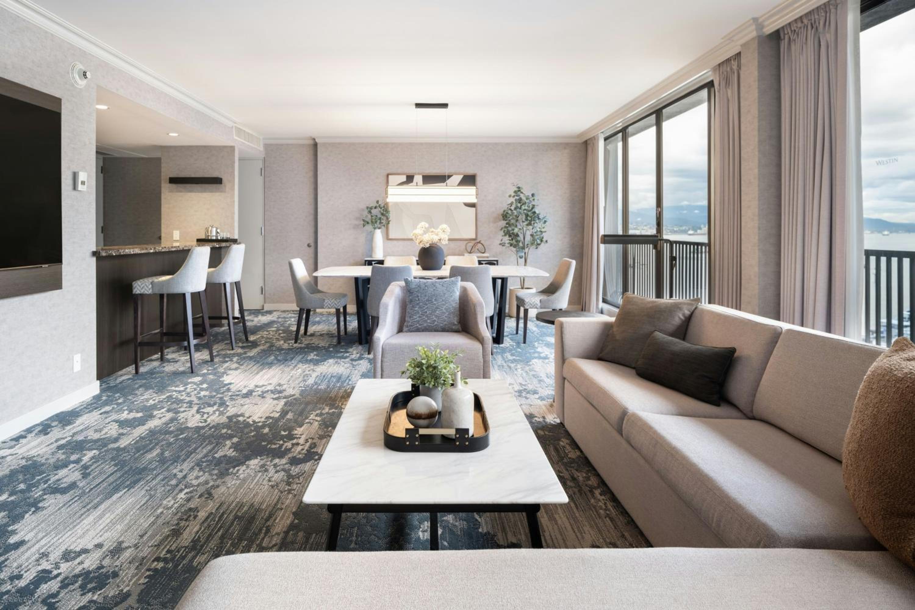 One-Bedroom King Suite with Harbor View, Living Room, Dining Area and Sofa Bed