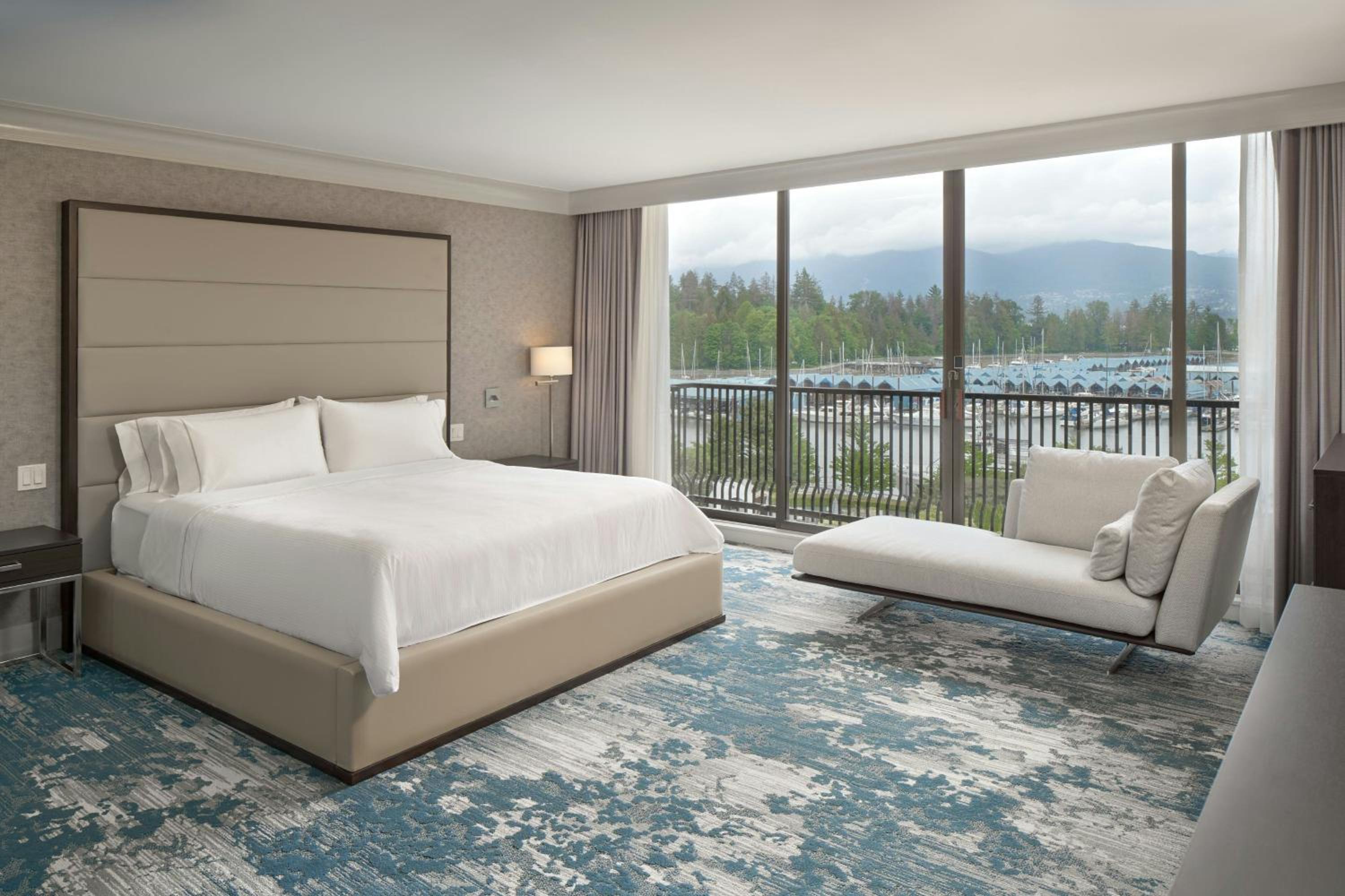 Two-Bedroom Suite with One King Bed, Two Double Beds, Harbor View, Balcony, Living Room, Dining Area and Sofa Bed