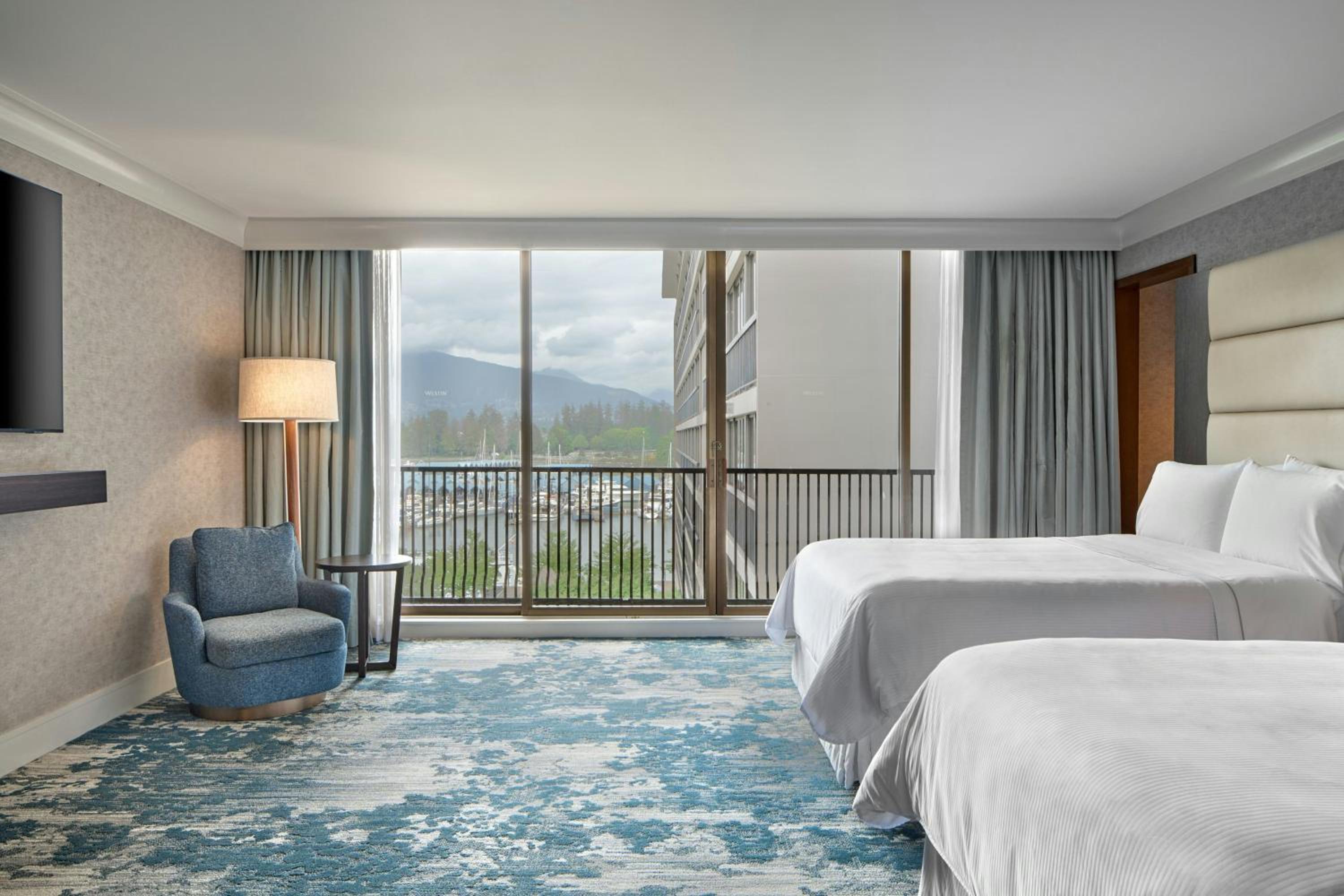 Two-Bedroom Suite with One King Bed, Two Double Beds, Harbor View, Balcony, Living Room, Dining Area and Sofa Bed