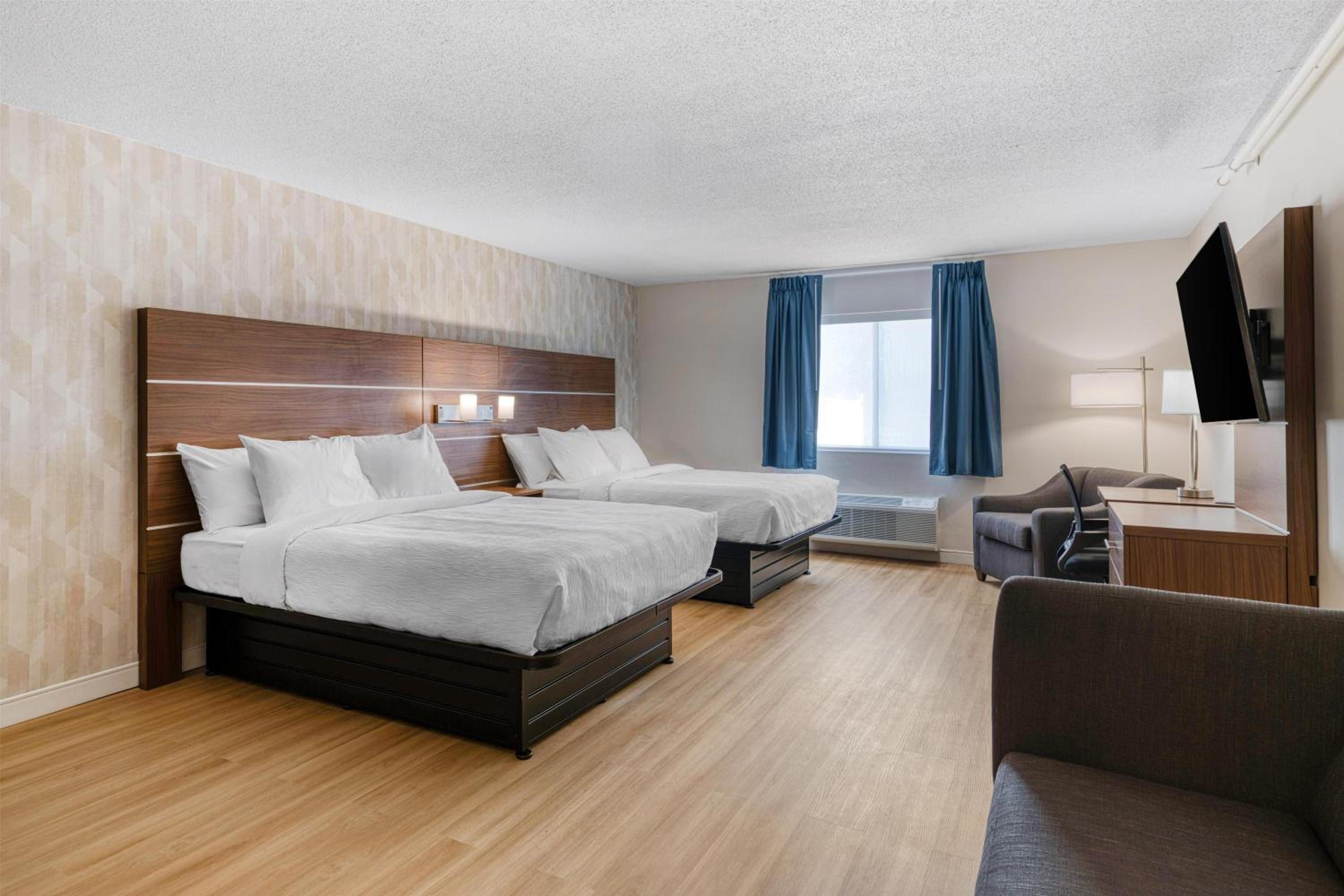 Larger Room with Two Queen Beds, Sofa Bed, Balcony and Living Area - Non-Smoking