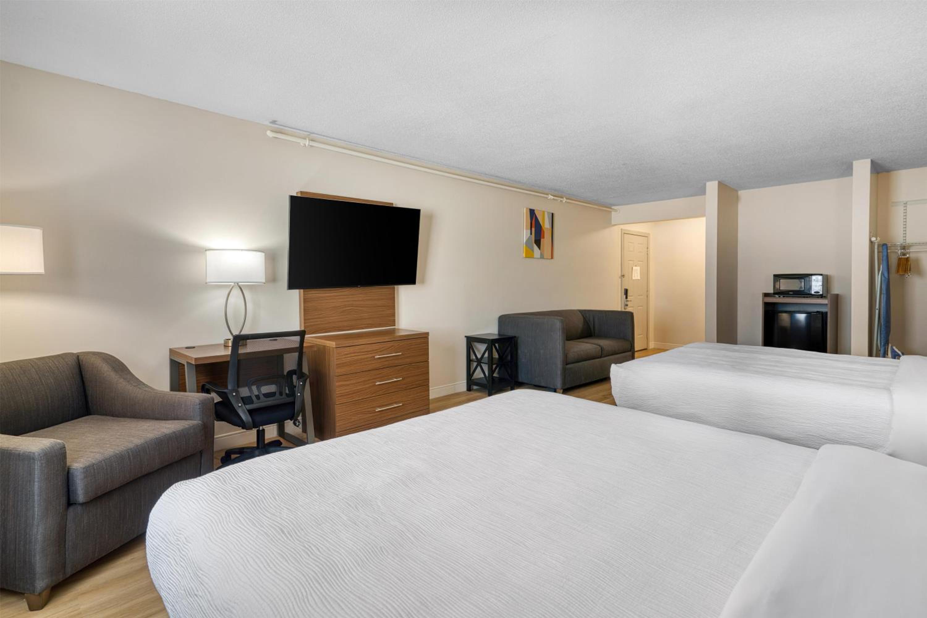 Larger Room with Two Queen Beds, Sofa Bed, Balcony and Living Area - Non-Smoking photo 3